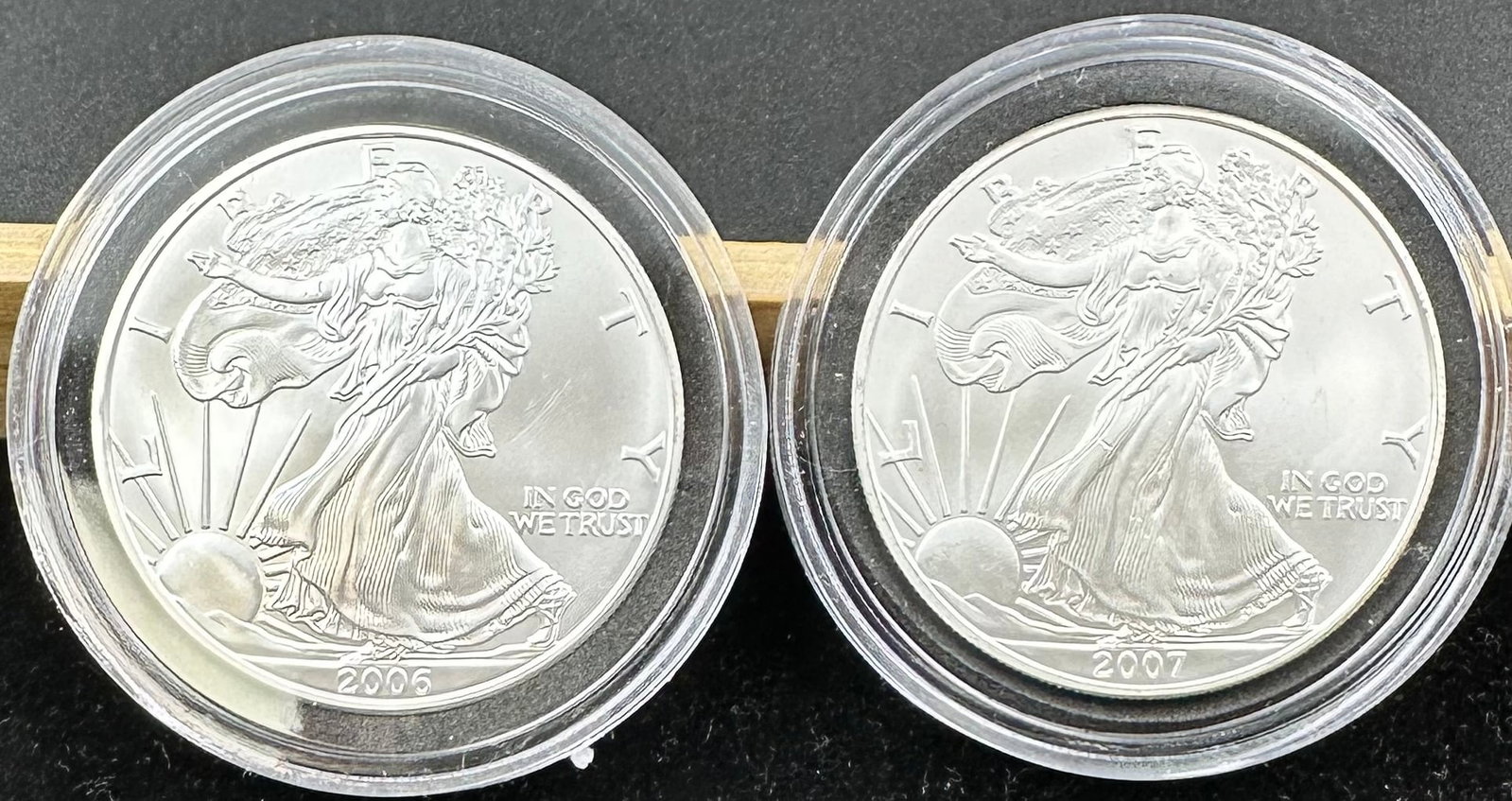 2 American Silver Eagles 2006 & 2007: You are bidding on 2 American Silver Eagles each in a hard plastic case. Shipping dimensions and given are for item(s) packaged.