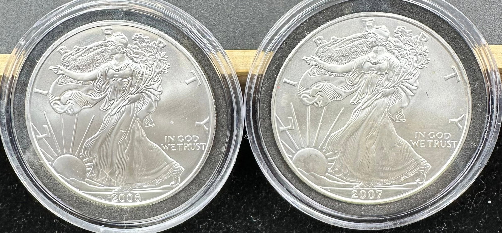 2 American Silver Eagles 2006 & 2007: You are bidding on 2 American Silver Eagles each in a hard plastic case. Shipping dimensions and given are for item(s) packaged.