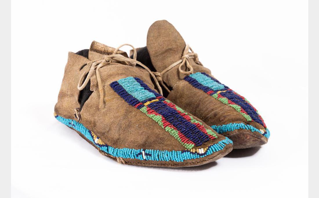Sioux Beaded Man's Moccasins: Sioux Beaded Man's Moccasins 10" long with partially beaded vamps in geometric designs. $600-900 Provenance: Private Collection, Conner, MT.