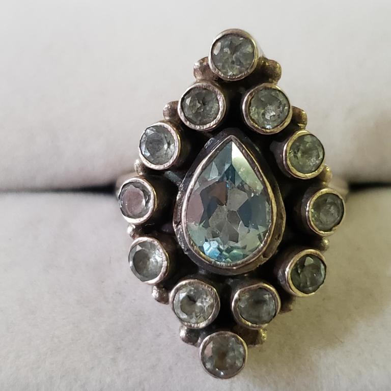 $140 Silver Blue Topaz Ring: Silver Blue Topaz Ring (~Size 6)(Ring is resizable for $40) (~weight 7.57g), Suggested Retail Value $140