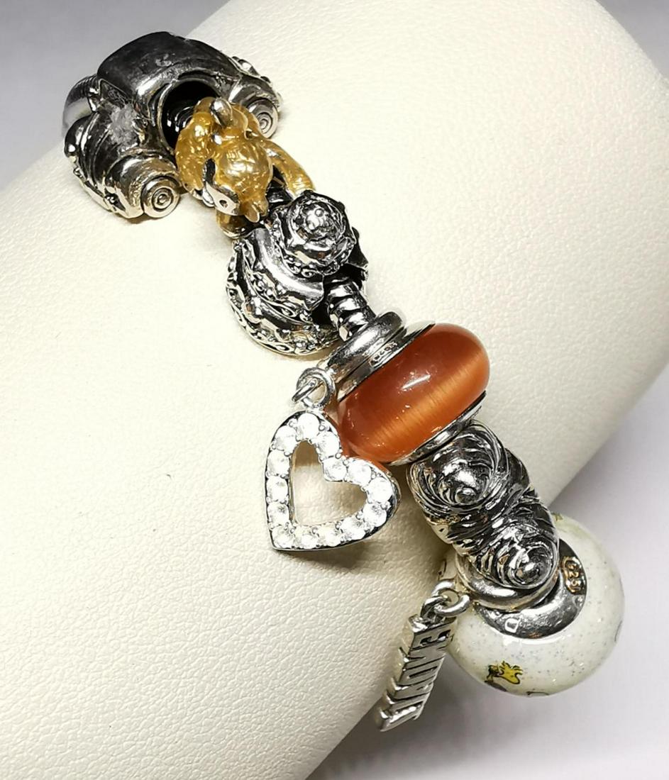 $400 Silver Pandora Style (23.98G) Bracelet: Silver Pandora Style (23.98G) Removable Beads Bracelet (~length 7inches), Suggested Retail Value $400 (Estimated Selling Price from $60 to $120)