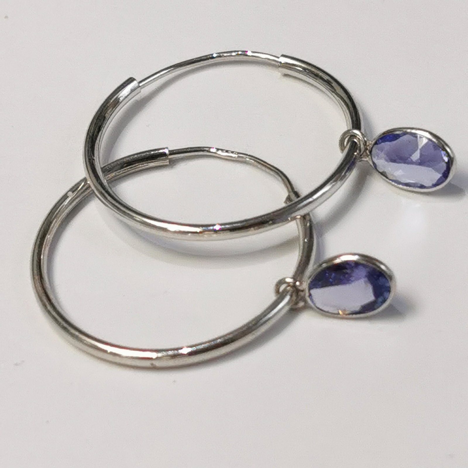 Certified 10K Tanzanite(1.4ct) Earrings: 10K White Gold Tanzanite(1.4ct) Earrings (~weight 1.34g), Made in Canada, Suggested Retail Value: $600