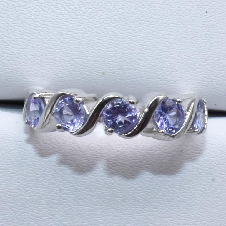 Sterling Silver Tanzanite(1.8ct) Ring: Sterling Silver Tanzanite(1.8ct) Rhodium Plated Ring (~Size 7)(Ring is resizable for $40) (~weight 3.6g)