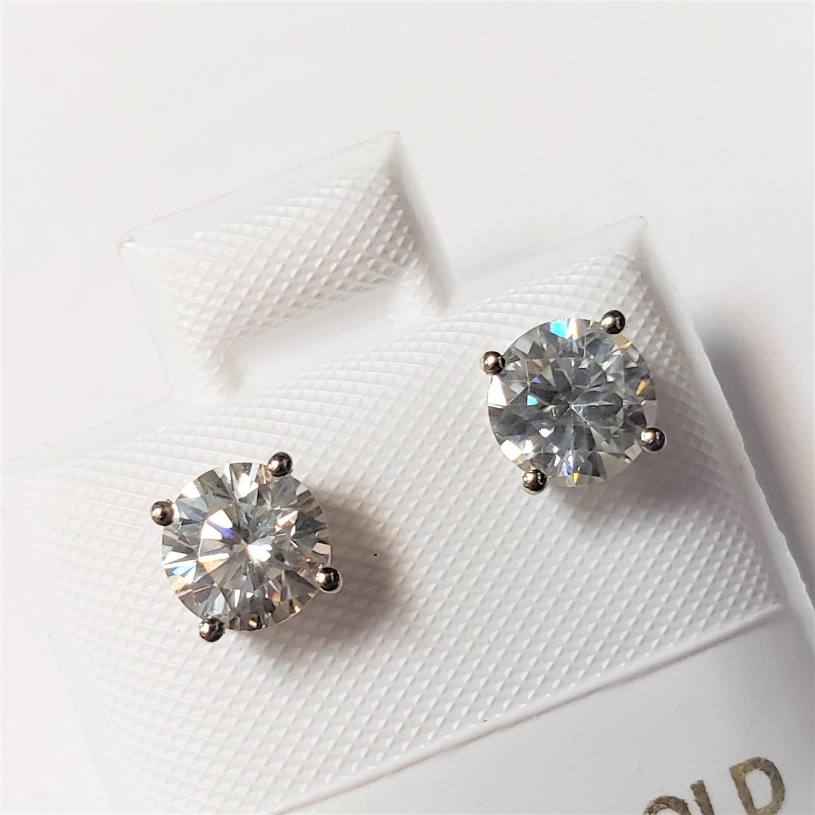 Certified14K White Moissanite(1.12ct) Earrings: 14K White Gold White Moissanite(1.12ct) Earrings (~weight 0.89g), Made in Canada, Suggested Retail Value:$600