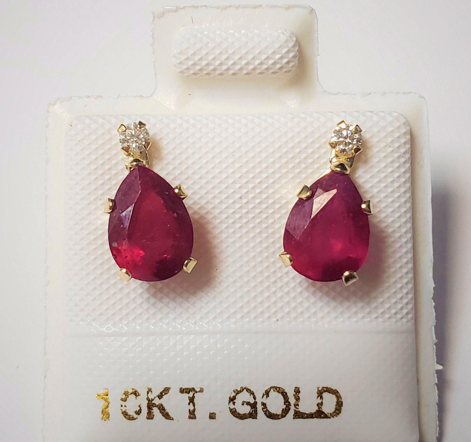 $400 10K Ruby(1.8ct) Moissanite(.05Ct)(0.05ct) Earrings: 10K Yellow Gold Ruby(1.8ct) Moissanite(.05Ct)(0.05ct) Earrings, Made in Canada, Suggested Retail Value $400