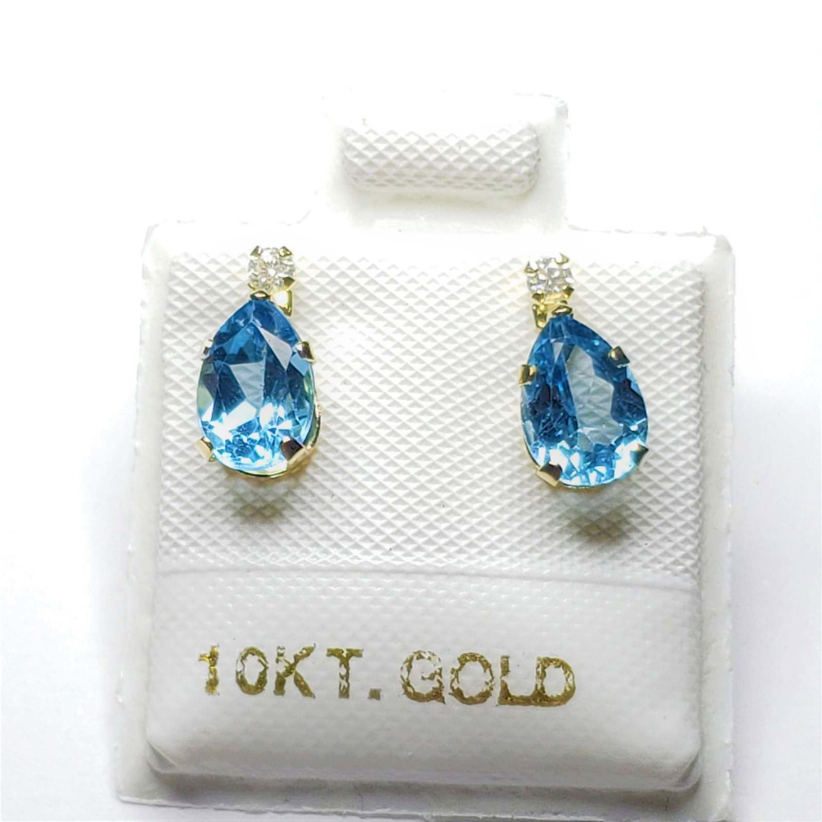 $360 10K Blue Topaz(1.5ct) Moissanite(.06Ct)(0.06ct) Earrings: 10K Yellow Gold Blue Topaz(1.5ct) Moissanite(.06Ct)(0.06ct) Earrings, Made in Canada, Suggested Retail Value $360