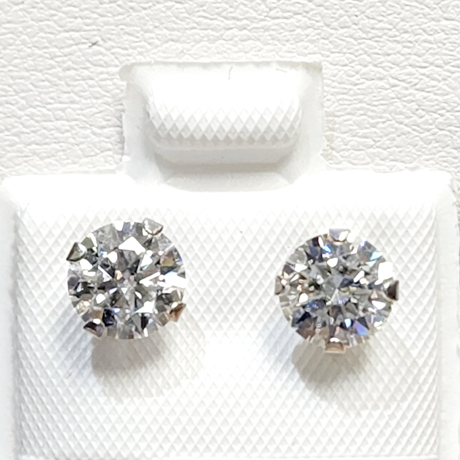 Certified10K White Moissanite(1.52ct) Earrings: 10K White Gold White Moissanite(1.52ct) Earrings (~weight 0.72g), Made in Canada, Suggested Retail Value:$400