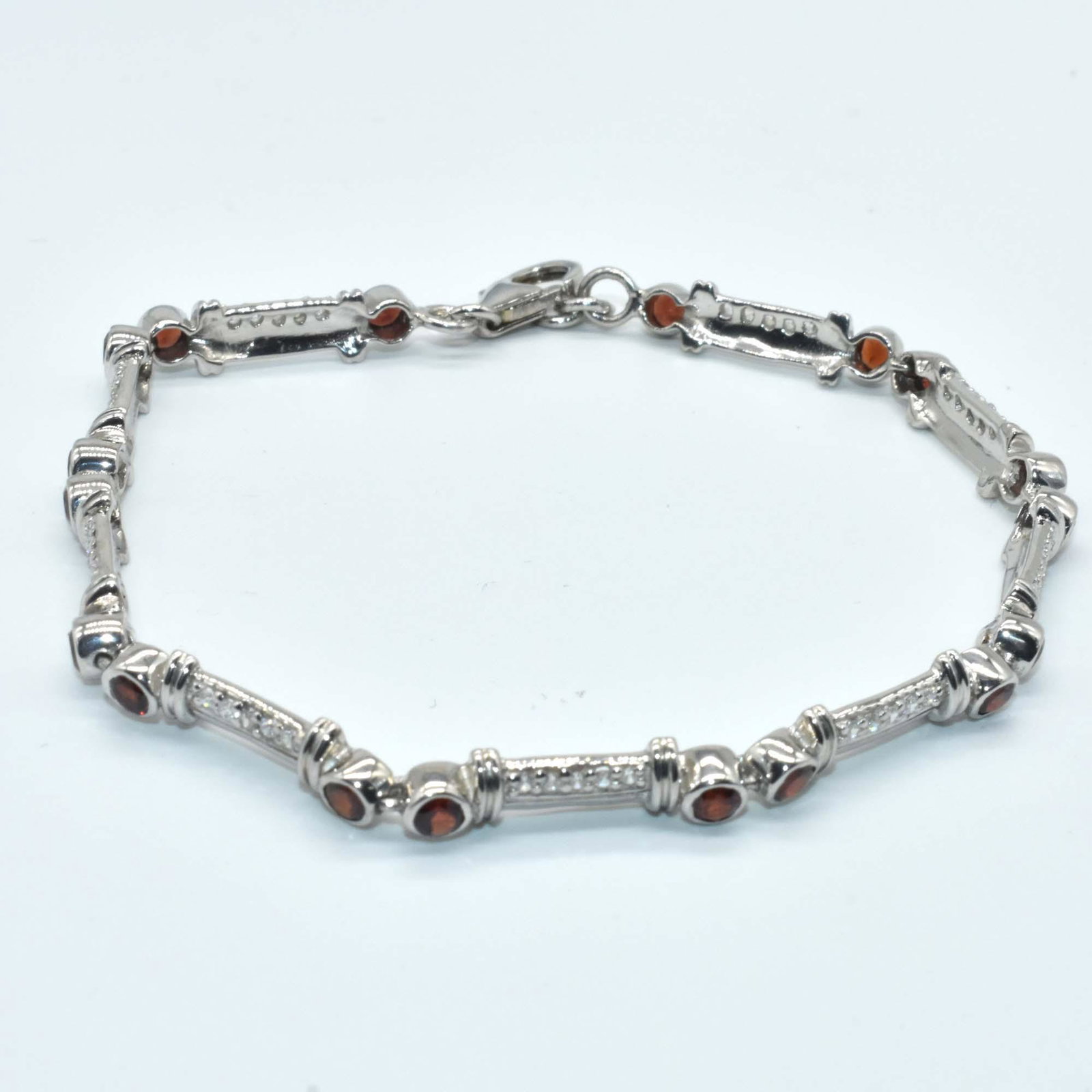 $320 Silver Garnet(1.15ct) Bracelet: Silver Garnet(1.15ct) Rhodium Plated Bracelet (~Size 0) (~length 7.5 inches) (~weight 6.8g), Suggested Retail Value $320
