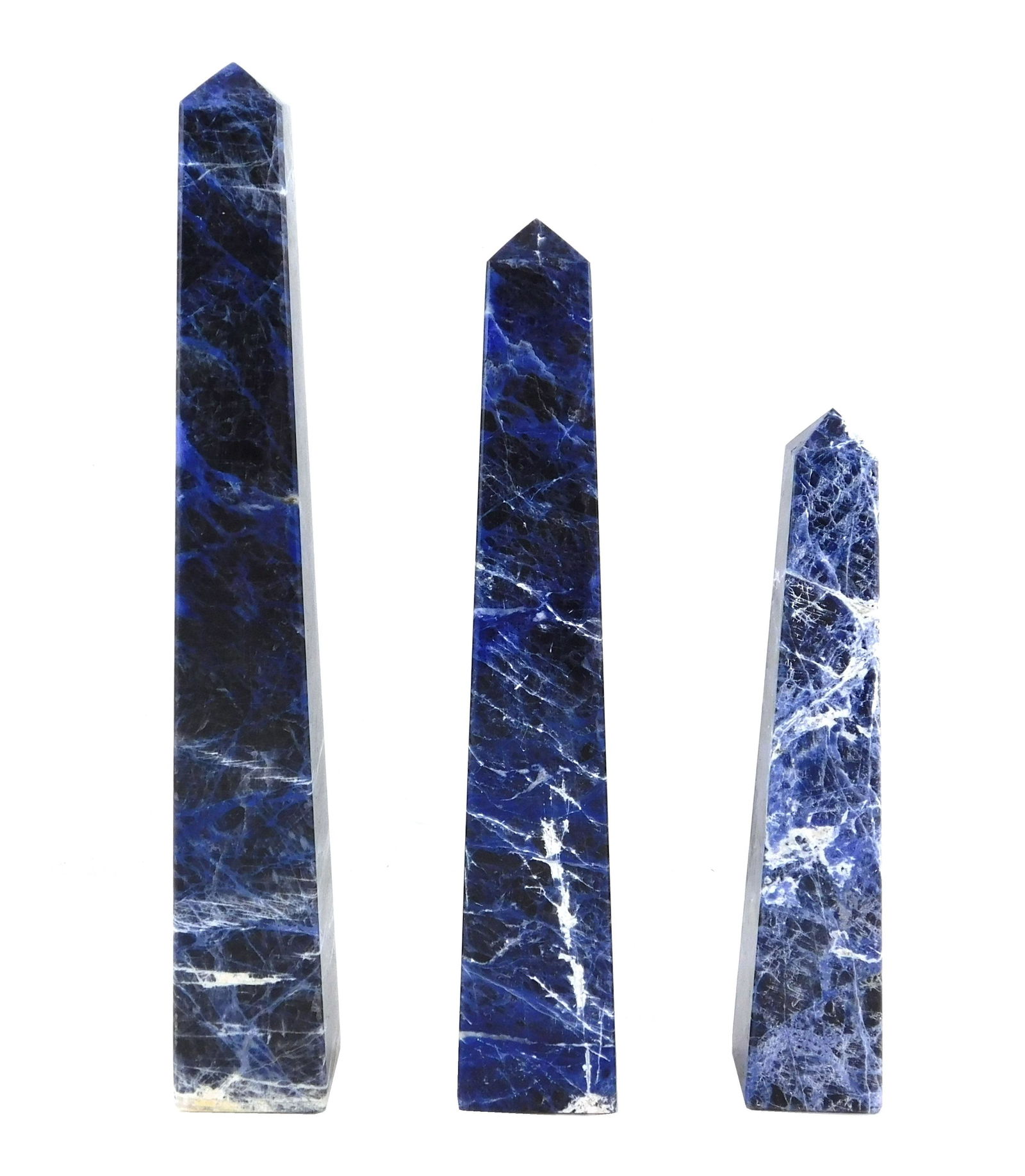 Three sodalite obelisks, all with rich blue color and: Three sodalite obelisks, all with rich blue color and white veining, wear consistent with age and use, largest: 14" h.