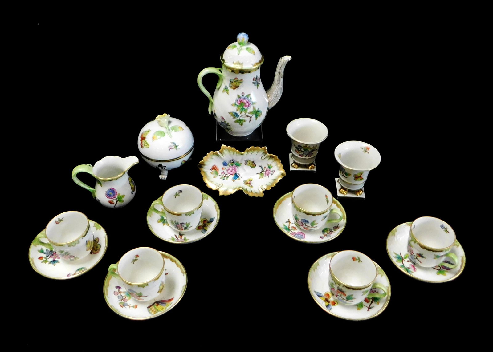 CHINA: Herend "Queen Victoria" pattern tea set and: CHINA: Herend "Queen Victoria" pattern tea set and accessories, seventeen pieces along with one similar, polychrome floral and butterfly design on white ground, all signed on base, including: teapot w
