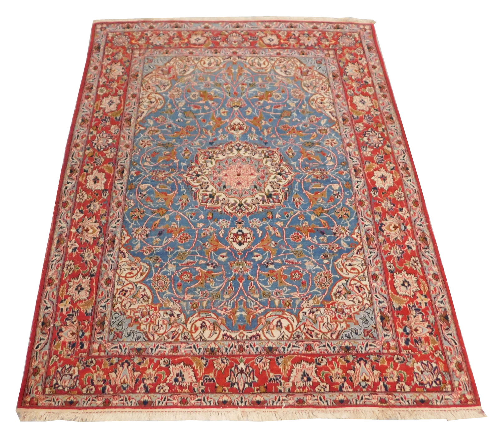 RUG: Semi-antique Persian Isfahan, 6' 3 1/2" x 4' 10",: RUG: Semi-antique Persian Isfahan, 6' 3 1/2" x 4' 10", red border encircles central medallion with scrolling vinework on medium blue ground, wear consistent with age and use including low and worn are