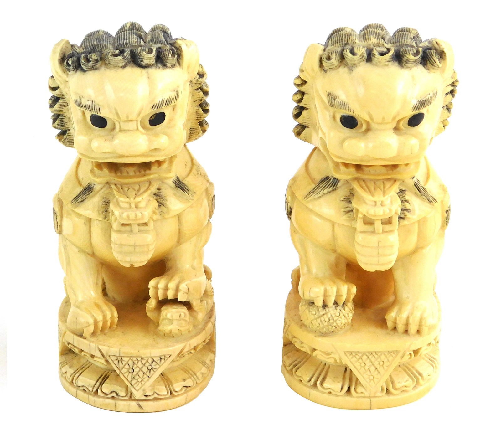 ASIAN: Pair of carved ivory Foo Dogs, deep relief: ASIAN: Pair of carved ivory Foo Dogs, deep relief carving, male holds ball beneath foot, female holds pup beneath foot, both signed on base, both on ivory bases, condition consistent with age and use
