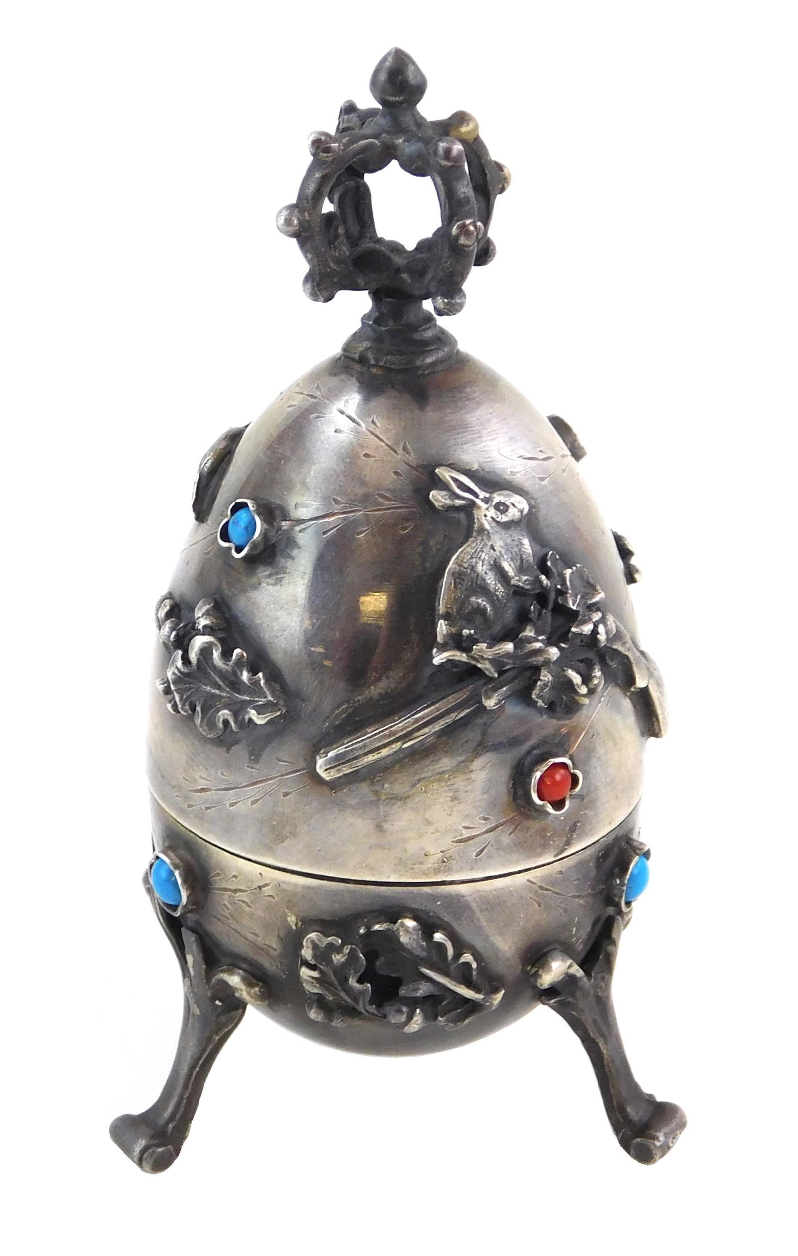 RUSSIAN SILVER: Imperial Russian silver hunting egg: RUSSIAN SILVER: Imperial Russian silver hunting egg opens to reveal figural rabbit, exterior with applied decorations and accents comprising of a flying goose, a rabbit perched atop a shotgun and foli