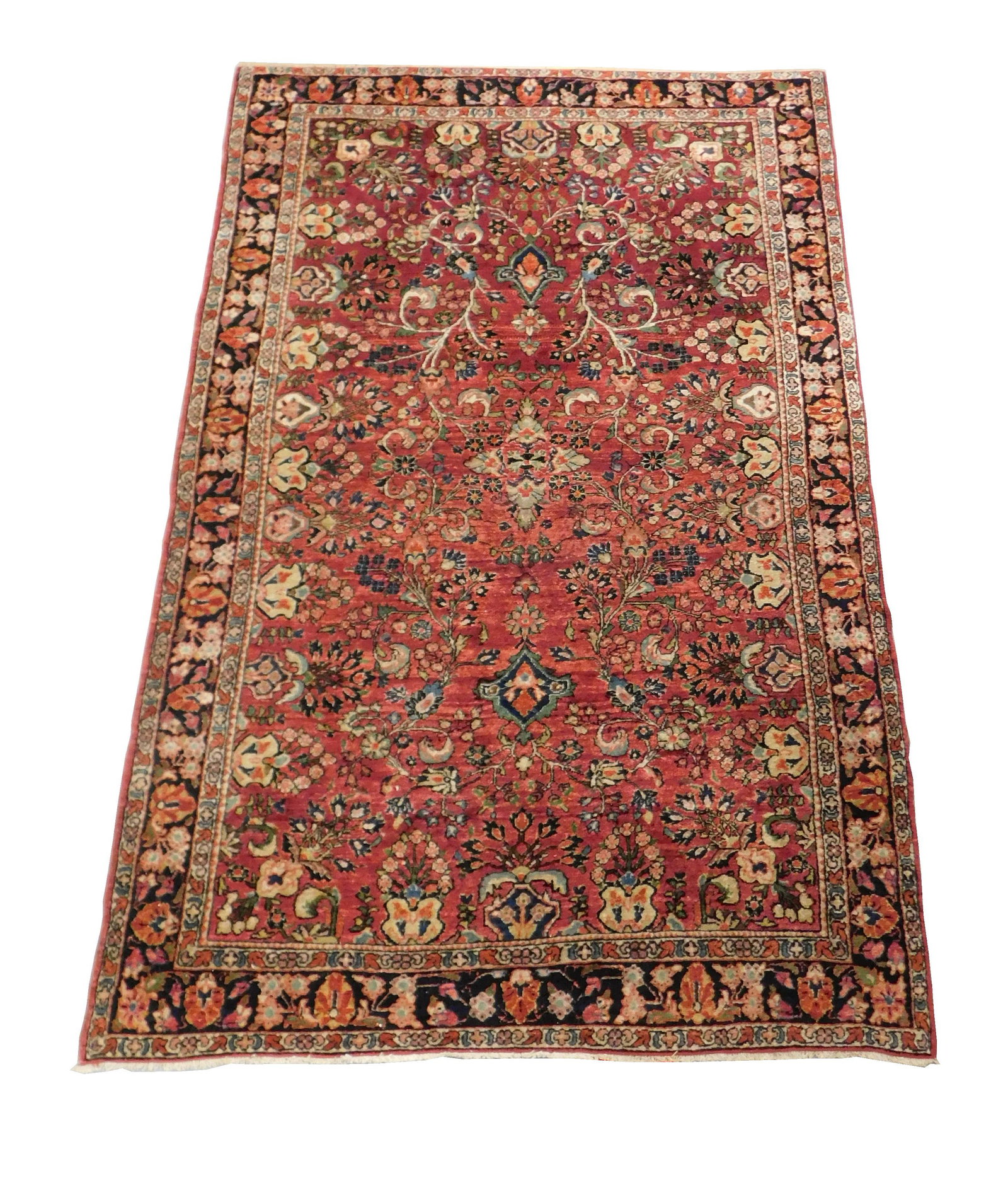 RUG: Antique Persian Sarouk, 6' 10" x 4' 2", finely: RUG: Antique Persian Sarouk, 6' 10" x 4' 2", finely woven by hand, 100% wool on cotton fibers, overall floral design on red ground with scrolling vines, wear consistent with age and use including low