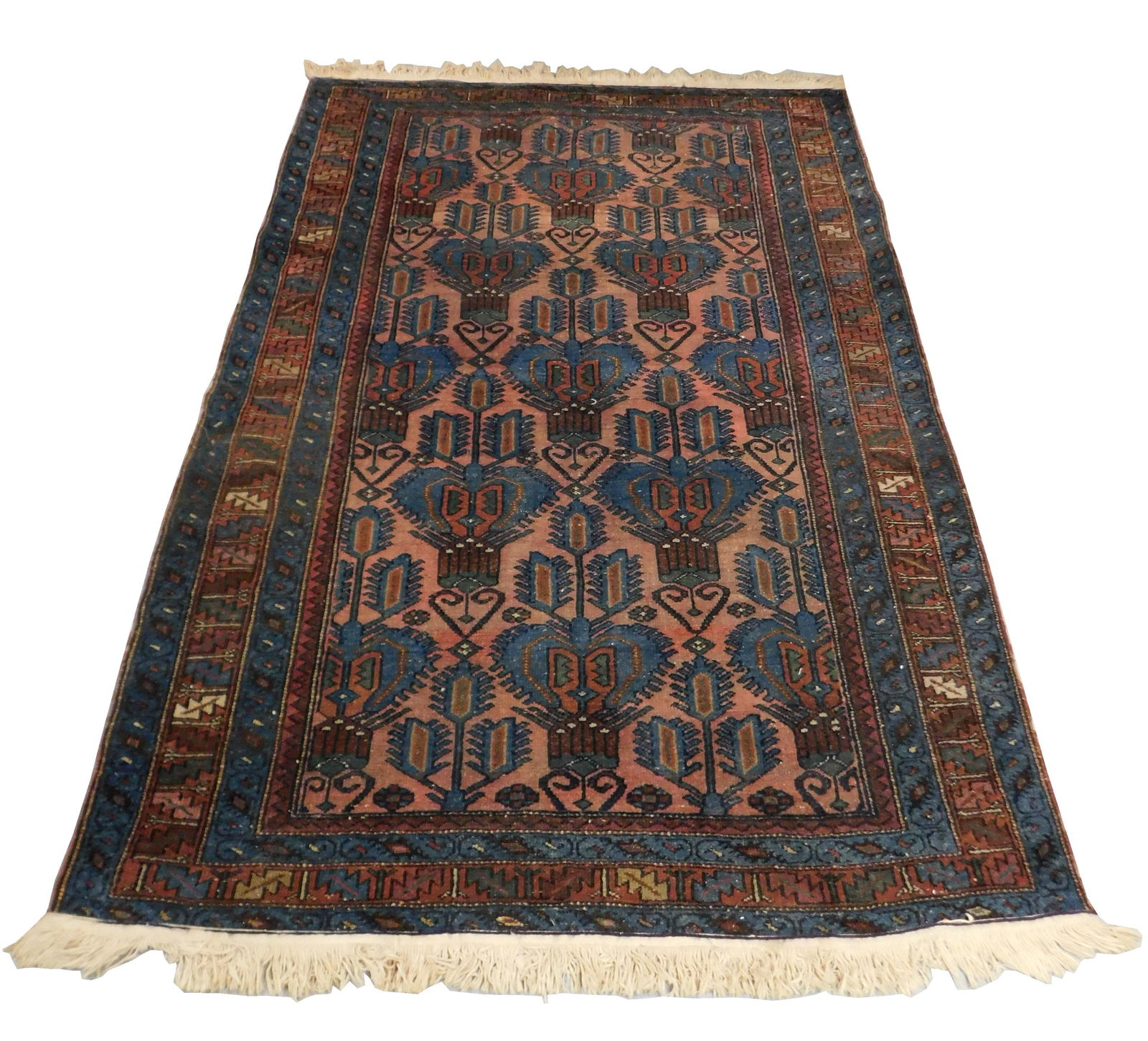 RUG: Semi-antique Persian Hamadan, 6' 6" x 4' 4",: RUG: Semi-antique Persian Hamadan, 6' 6" x 4' 4", finely woven by hand, 100% wool on cotton fibers, pink, repeating blue medallions with serrated leaf design on dusty rose ground, wear consistent with