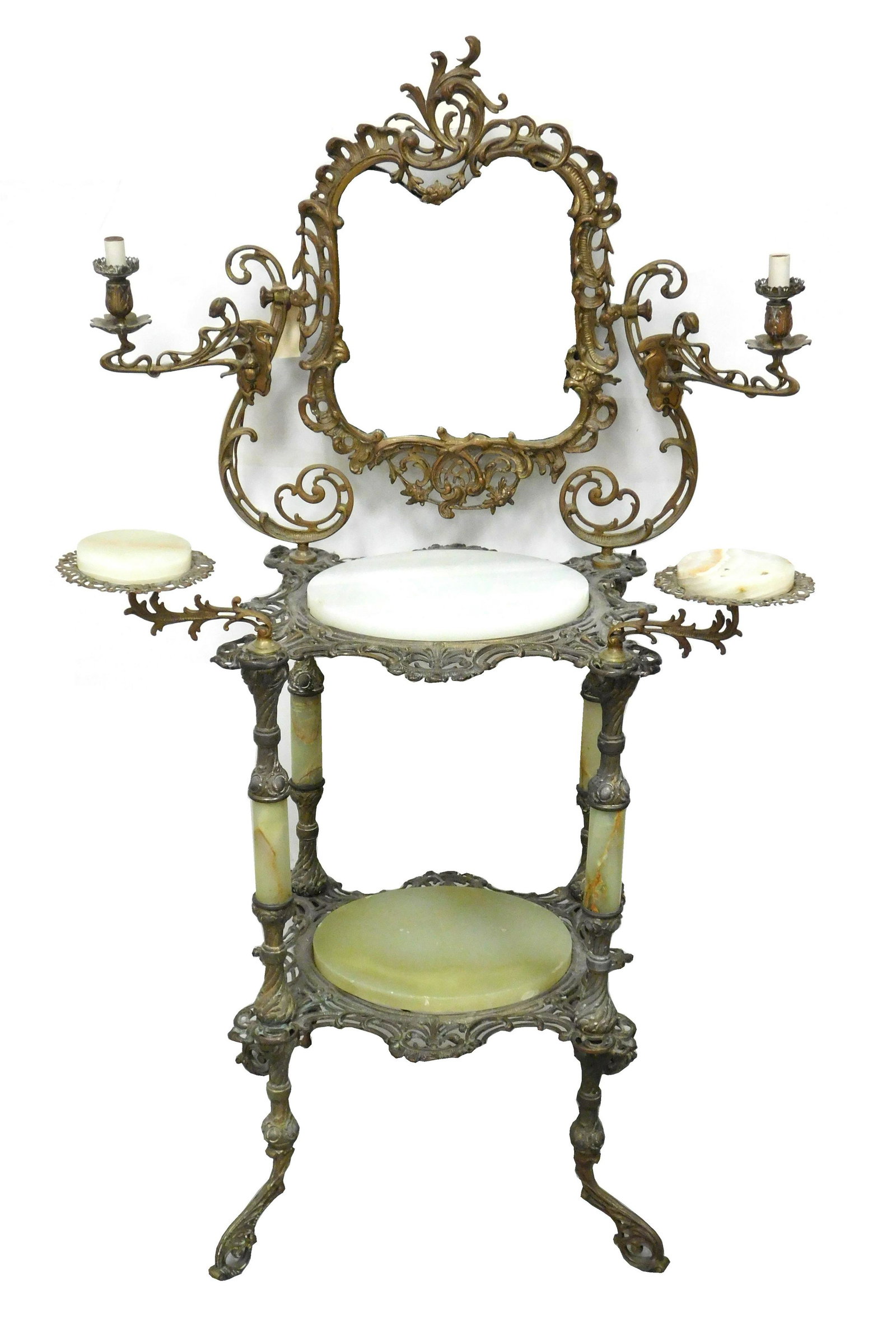 Brass and onyx vanity/ shaving stand with beveled: Brass and onyx vanity/ shaving stand with beveled mirror, two candle arms, green oval inset stone with veining, wear consistent with age and use, repaired damage to bottom onyx, small chips, wear to f