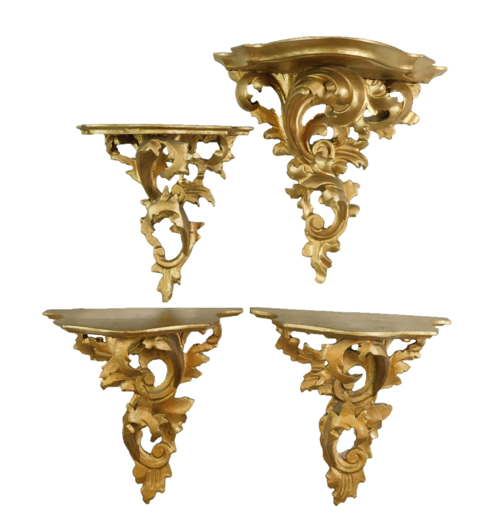 Four gilt scroll shelves, 20th C., one pair and two: Four gilt scroll shelves, 20th C., one pair and two individual, all with wear consistent with age and use, largest: 10 1/2 "h. x 10 1/2 "w. x 6" d.