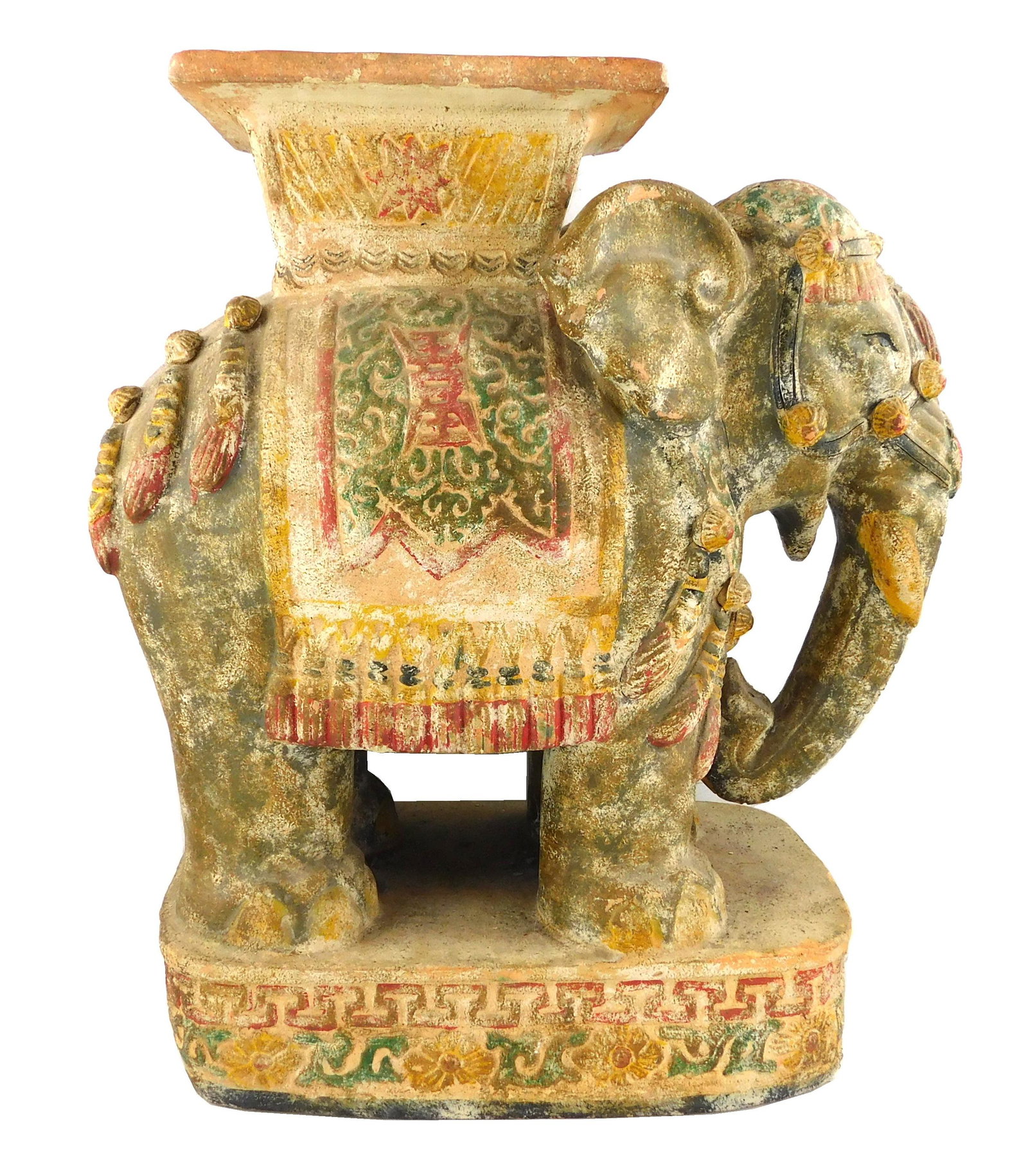 Ceramic elephant garden seat, platform top rests on: Ceramic elephant garden seat, platform top rests on elephant form base, remnants of polychrome painted accents, raised on oblong plinth base with rounded corners, wear consistent with age and use incl
