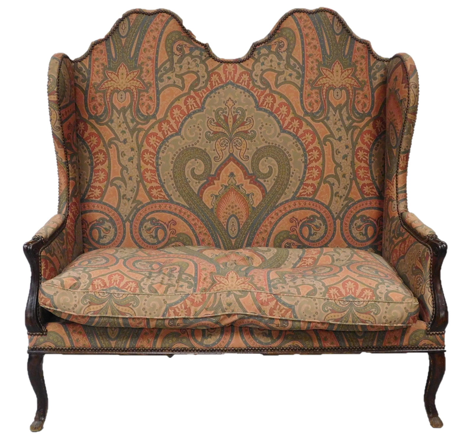 Continental style high back settee, 19th to early 20th: Continental style high back settee, 19th to early 20th C., mahogany stain, double-chair back with upholstered armrests and skirt, custom upholstery in green and rust paisley pattern on dark rose groun