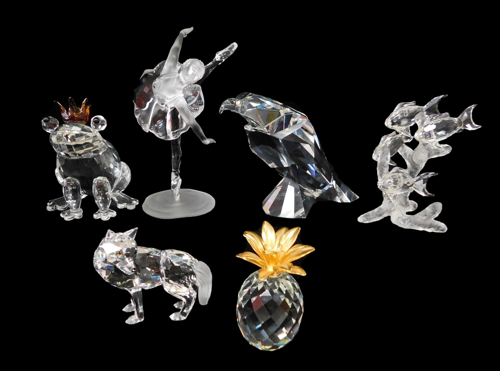 GLASS: Swarovski and Swarovski-type glass, six pieces,: GLASS: Swarovski and Swarovski-type glass, six pieces, including: Swarovski eagle; Swarovski pineapple with gilded fronds, nicks to base; Swarovski wolf; frosted and bejeweled ballet dancer; frog with