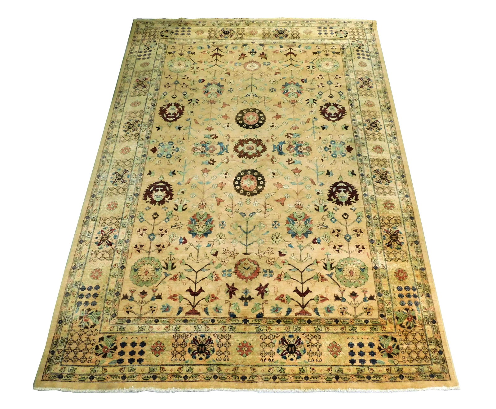 RUG: Pakistan Peshawar, 10' x 14', hand-knotted, 100%: RUG: Pakistan Peshawar, 10' x 14', hand-knotted, 100% wool on cotton, allover floral design on dark beige ground with accents of chocolate, merlot, and celadon, light wear consistent with age and use.
