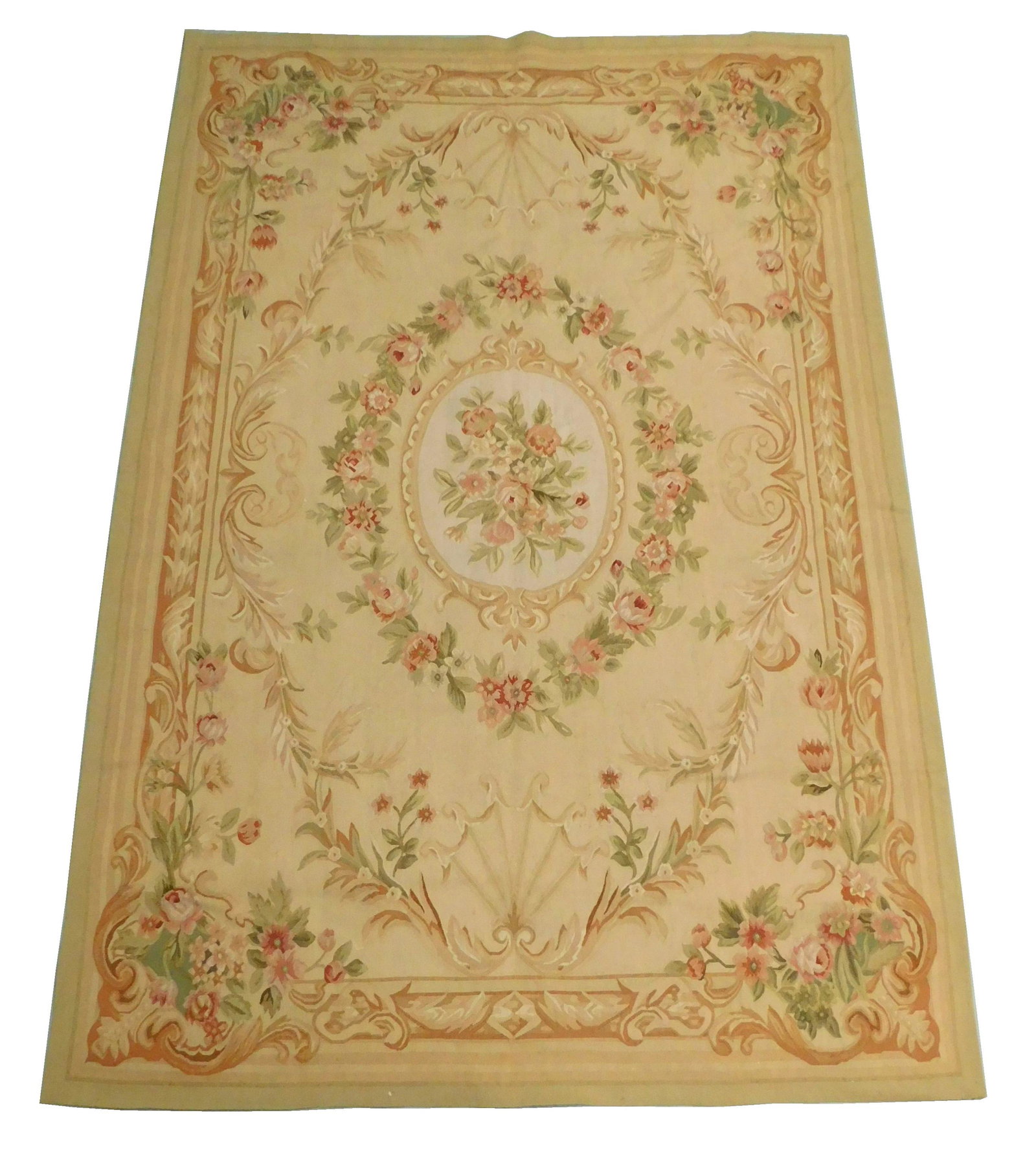 RUG: Chinese Aubusson, 6' x 9', hand-knotted, 100% wool: RUG: Chinese Aubusson, 6' x 9', hand-knotted, 100% wool on cotton, pink floral design on tan ground with oval central medallion, light wear consistent with age and use.