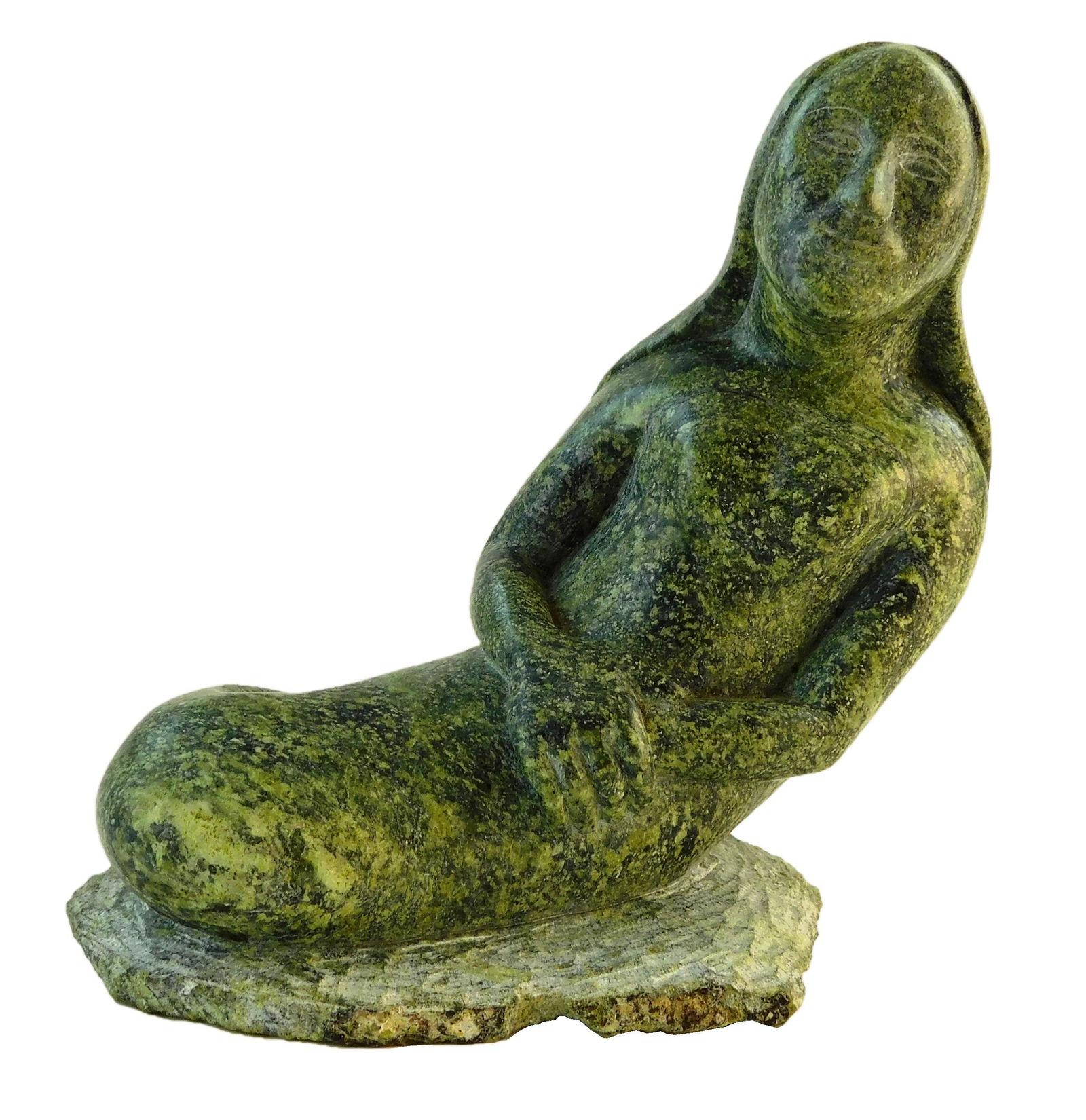 Inuit carved Goddess of the Sea sculpture, late 20th: Inuit carved Goddess of the Sea sculpture, late 20th C., carved from single piece of green stone, no signature found, depicts seated figure with hair split on back mimicking a fish tail, older paper l