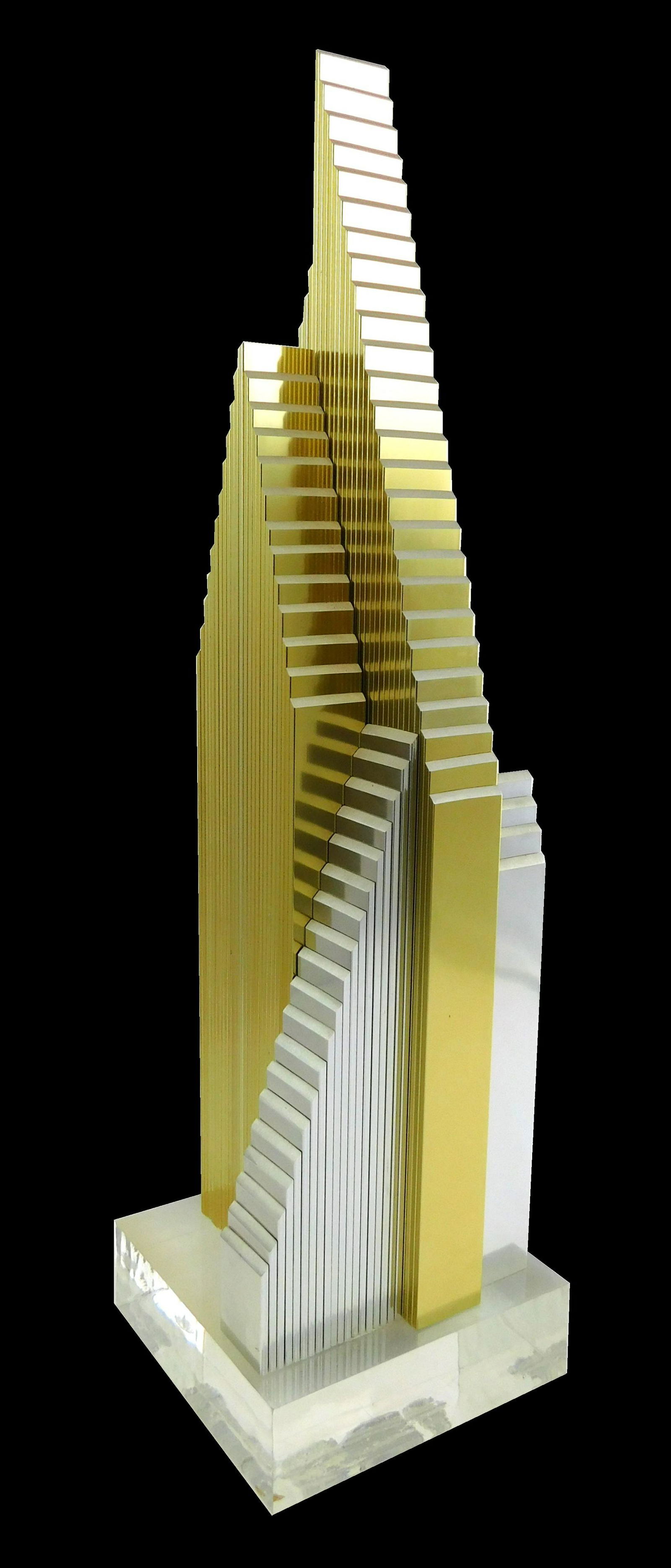 Dan Murphy (American, 20th C.), pyramidal metal: Dan Murphy (American, 20th C.), pyramidal metal sculpture on Lucite base, c. 1987, edition 3/10, skyscraper-like forms composed of mixed metals, various segmented stepped elements on all sides, signed