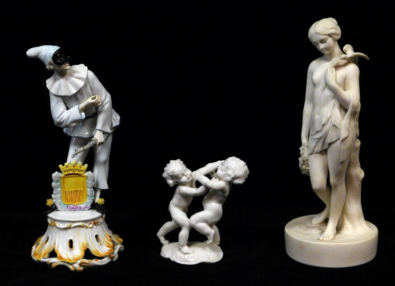 Three ceramic figurines, 20th C., including a Parian (1 of 3)