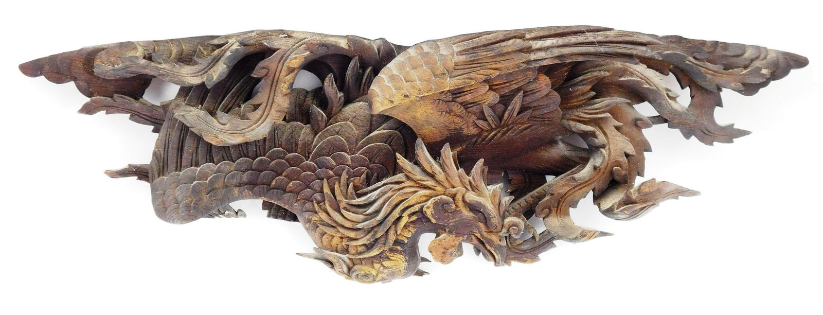Carved wood relief of a phoenix, the head bends under (1 of 2)
