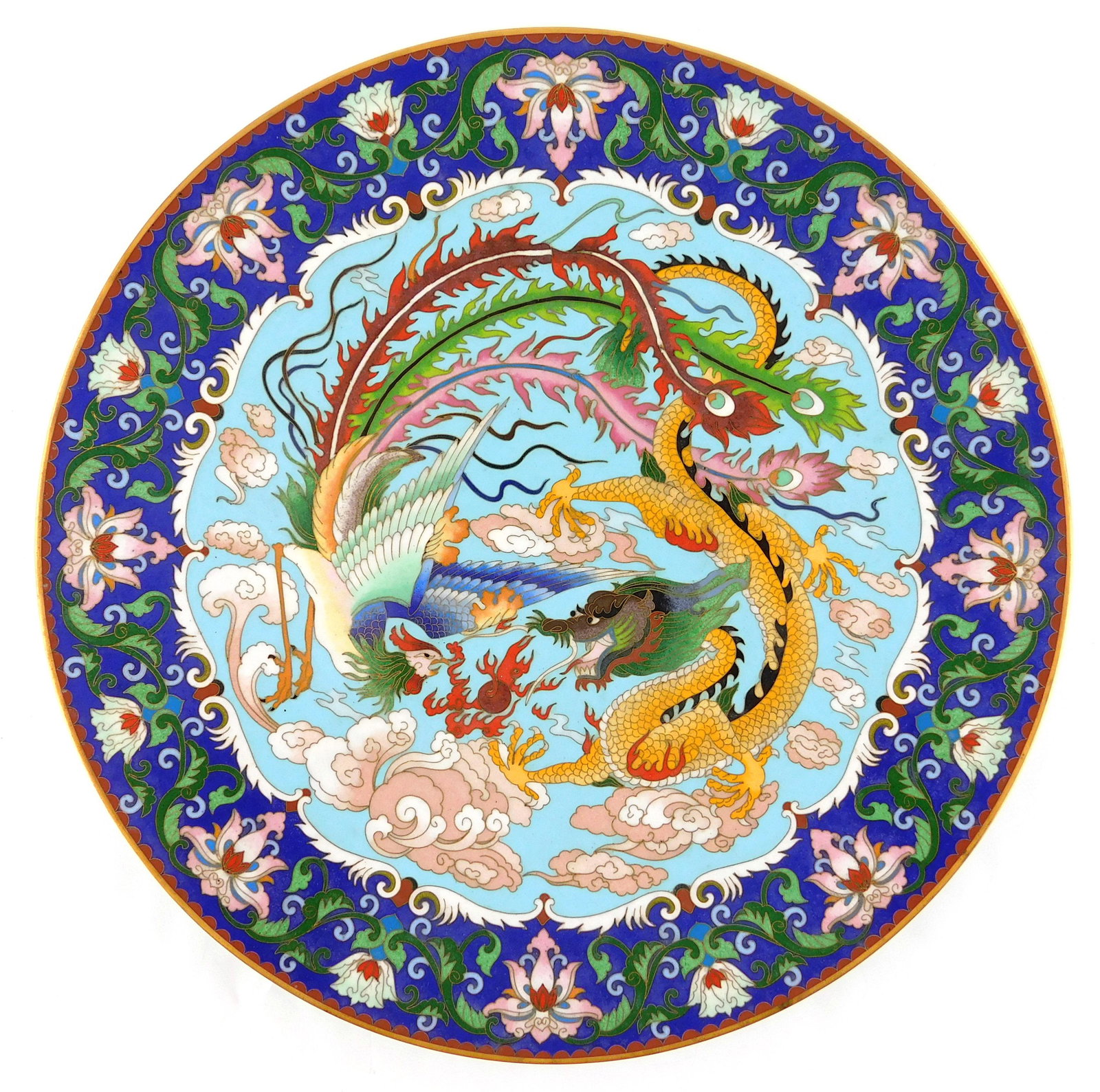 ASIAN: CloisonnÃ© charger, Chinese, 20th C., design: ASIAN: CloisonnÃ© charger, Chinese, 20th C., design with dragon and phoenix engaging mid-flight, surrounded by royal blue and foliate rim, no obvious maker's mark viewed, wear consistent with age an