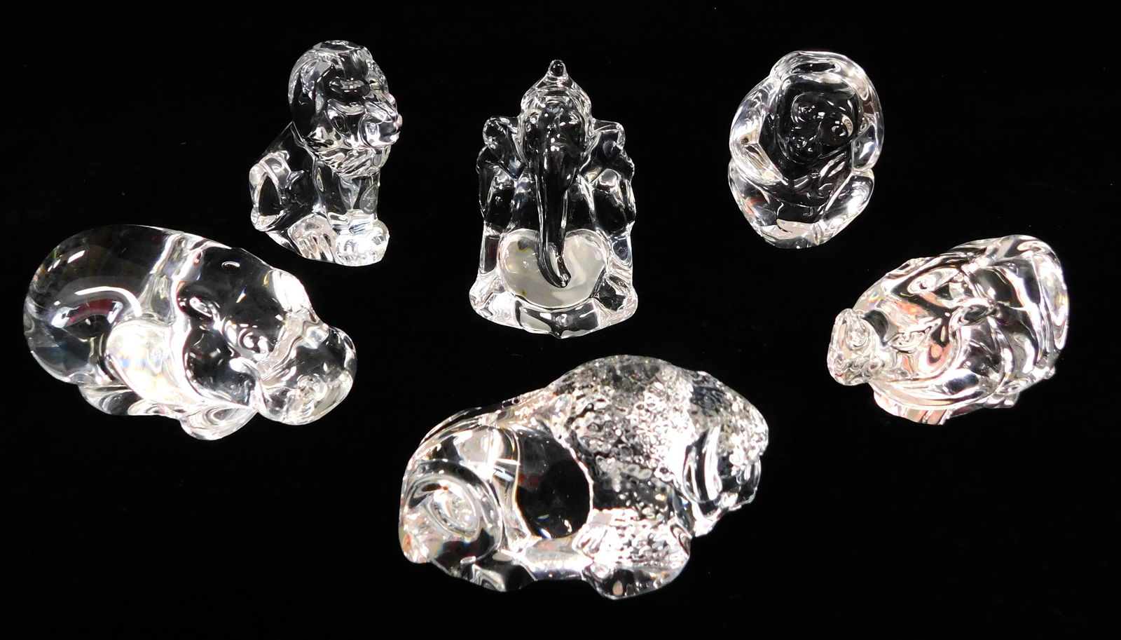 Steuben, six animal themed crystal hand coolers, four: Steuben, six animal themed crystal hand coolers, four with inscribed signature and two stamped (elephant, seated lion), pieces include: seated monkey; hippo; rhino; reclining buffalo; seated elephant