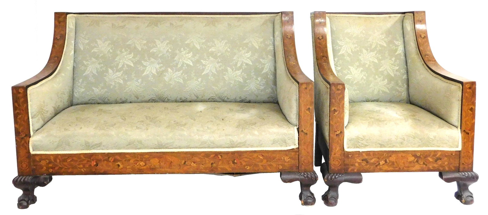 Sofa and armchair with Dutch marquetry, late 19th/: Sofa and armchair with Dutch marquetry, late 19th/ early 20th C., both with flowering scroll marquetry with red and ebony colored accents to top rail, arms and skirt, rests on two carved ball and claw