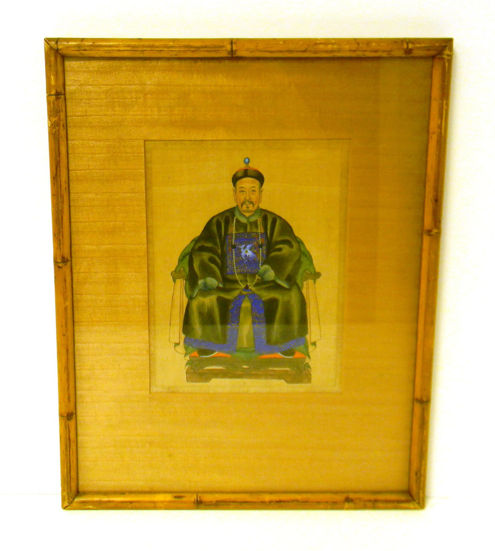 ASIAN: 19th / 20th C. hand-painted depiction of: ASIAN: 19th / 20th C. hand-painted depiction of enthroned Manchu gentleman on linen or silk, figure ensconced in green and gray robes with cobalt and gilt under robes, crane badge on chest indicating 