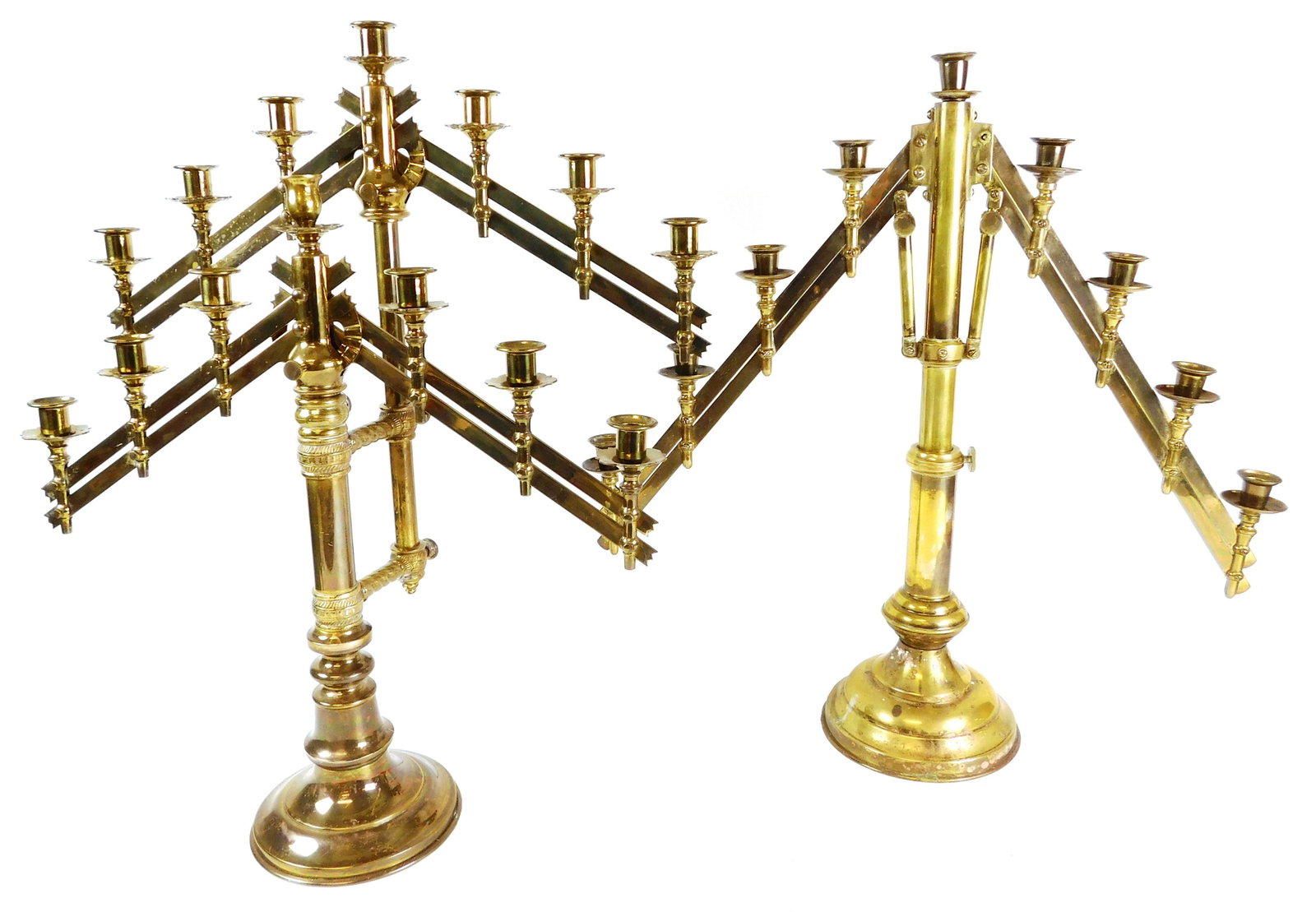 Two adjustable brass candelabras; arm on each side is: Two adjustable brass candelabras; arm on each side is movable up and down, lights along arm adjust to height as it changes, one with nine lights, stamped "Nov. 2, 1897", and one with fourteen in two t