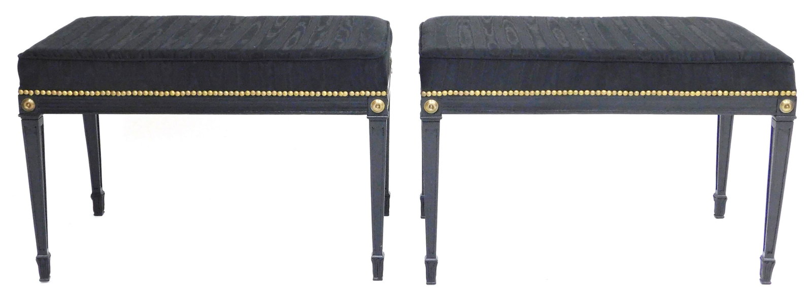Pair of benches with black faille upholstered seats and: Pair of benches with black faille upholstered seats and brass brad border, 20th C., square tapered legs with paneled sides and acanthus leaf carved feet, wear consistent with age and use including min