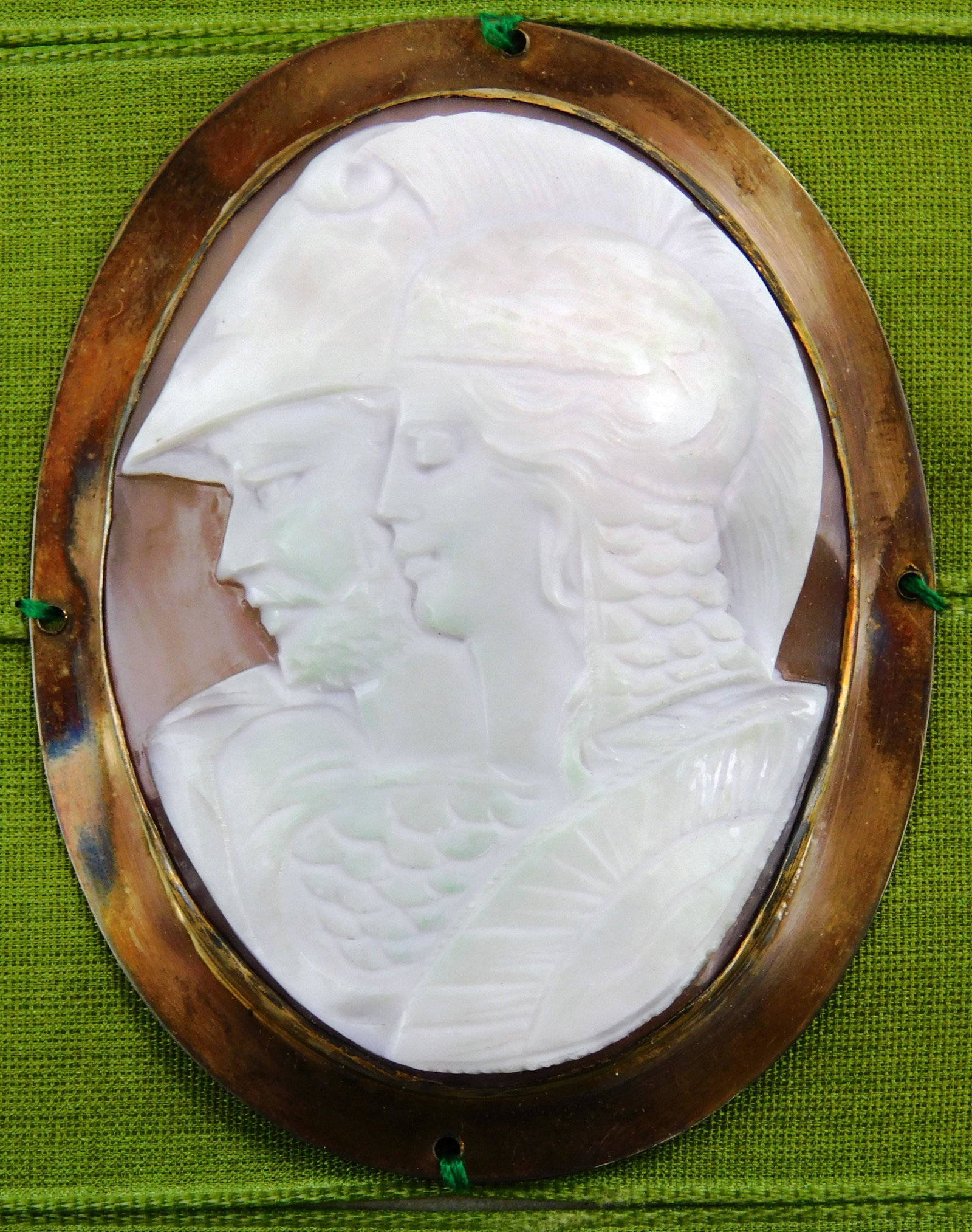 Double profile cameo of man and woman in military: Double profile cameo of man and woman in military regalia, carved shell in tested silver frame, housed in newer shadow box, no hallmarks observed, wear consistent with age and use, frame overall: 5 3/
