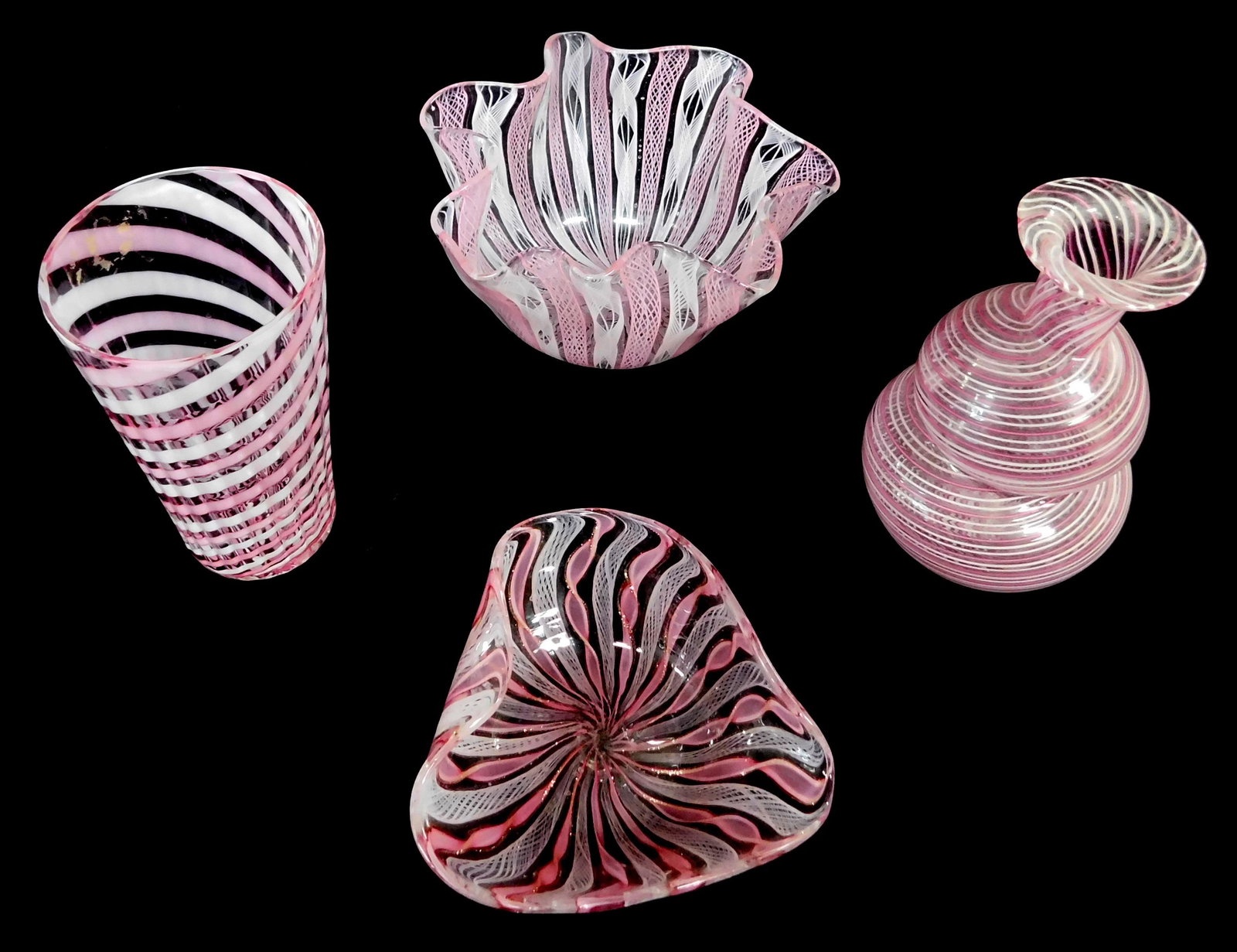 ART GLASS: Four pieces of Venetian glass with pink and: ART GLASS: Four pieces of Venetian glass with pink and white latticino decoration, Italian, 20th C., including: handkerchief bowl with pink and white retortoli decoration, 4 3/8" diam.; perfume bottle