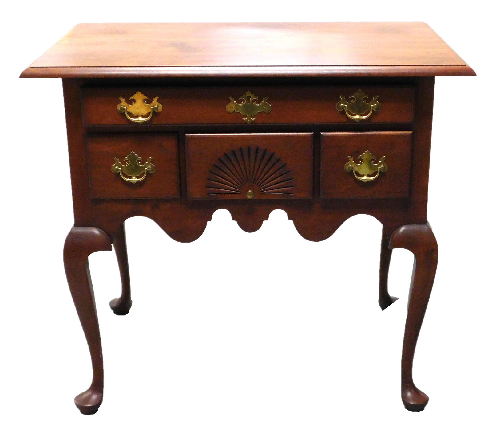 Eldred Wheeler of Hingham, Mass., mahogany lowboy,: Eldred Wheeler of Hingham, Mass., mahogany lowboy, Queen Anne reproduction featuring overhanging top with molded edge, case with shallow long drawer over shell carved central drawer flanked by two sho