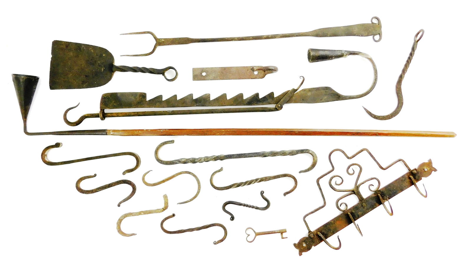 Iron fireplace accessories, sixteen pieces total,: Iron fireplace accessories, sixteen pieces total, including: ram's head two-tine fork, small peel with twisted handle, hanging ratchet candle holder, candle snuffer with long wood handle, heart-topped