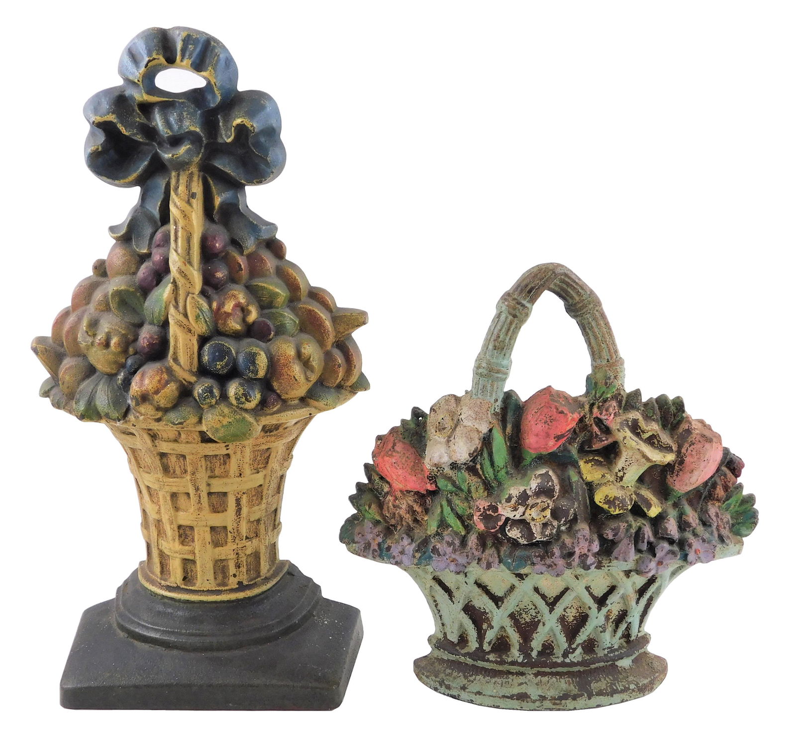 Hubley, etc., two large cast iron floral basket: Hubley, etc., two large cast iron floral basket doorstops with polychrome decoration including: Hubley, #11 Fruit Basket doorstop, 15" h.; and s shorter basket with v-shape pierced handle and varied f