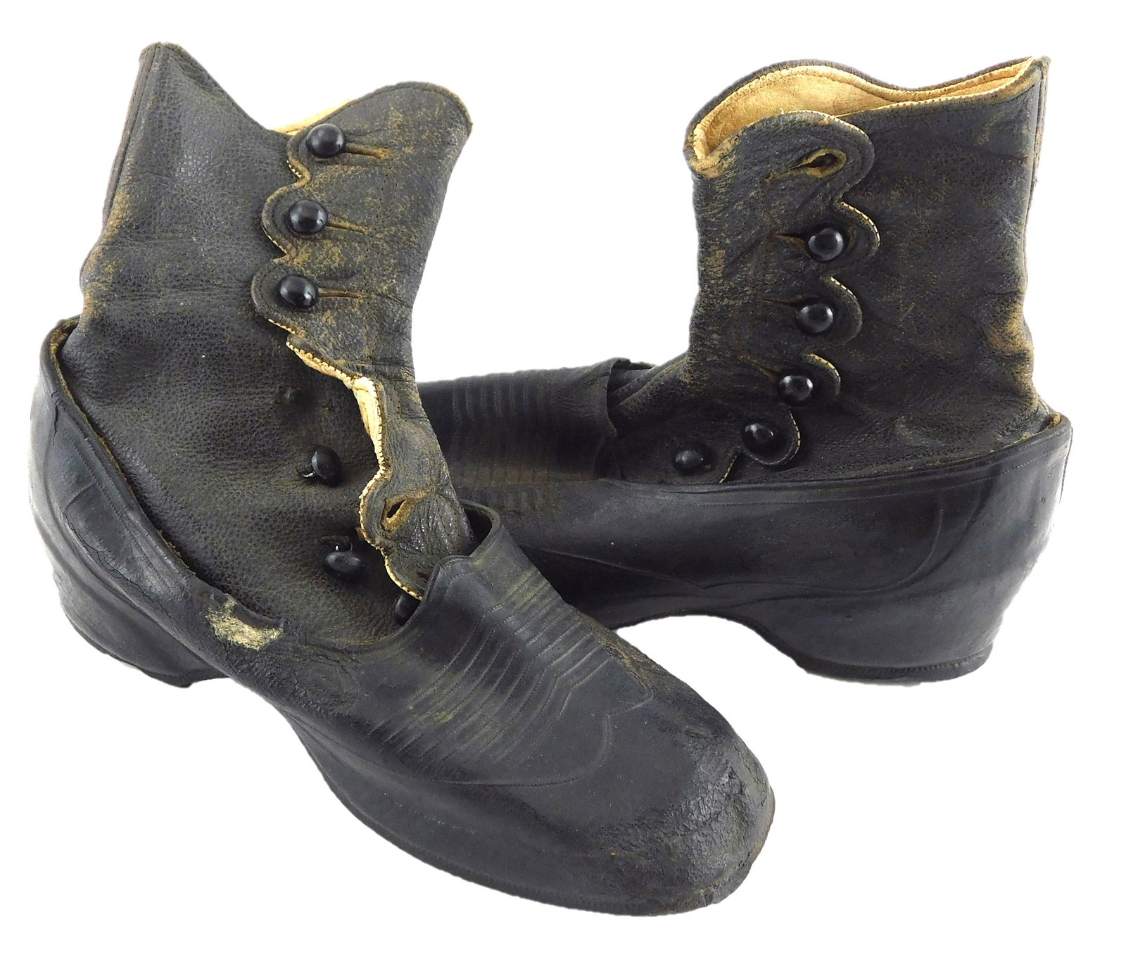 Victorian child's shoes, New Brunswick Rubber Co.,: Victorian child's shoes, New Brunswick Rubber Co., black boots fitted with removable galoshes, scalloped closure at ankles, stamp to soles, wear consistent with age and use, including scattered damage