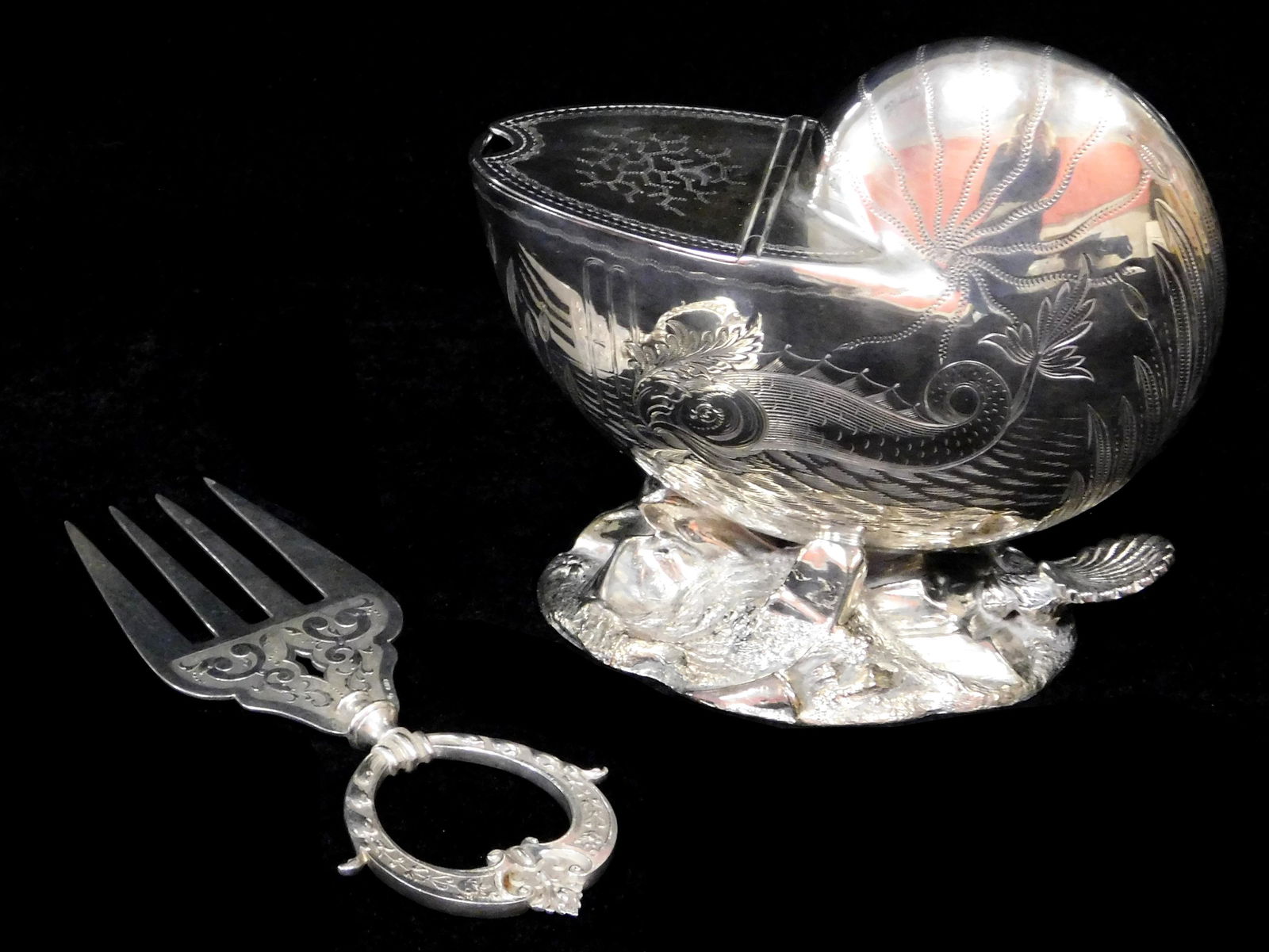 Silver Plate: Two pieces of ornate serving ware, nautilus shell spoon warmer, shell resting on a (1 of 3)