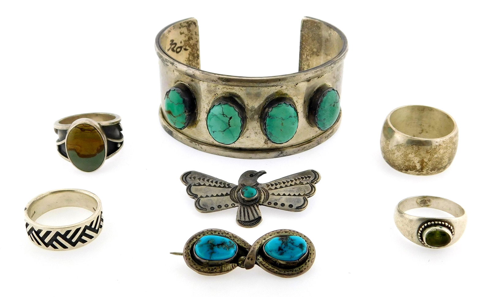 Seven pieces of silver including cuff bracelet, four rings and two pins, four pieces marked (1 of 2)