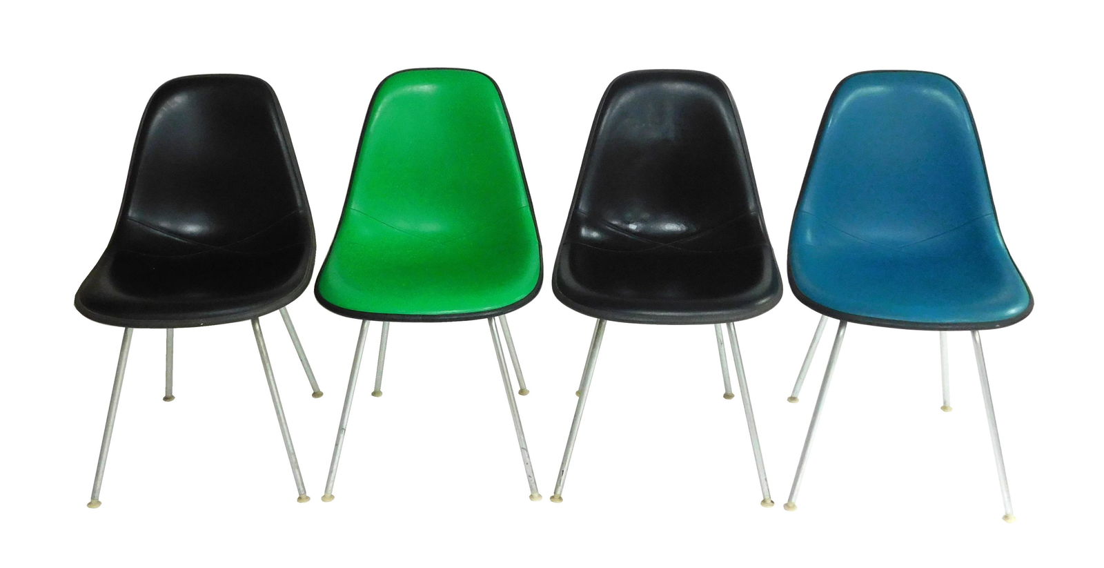 Four Herman Miller Eames DKX side chairs, c. 1960s, all signed on base, vinyl upholstery with "X" (1 of 5)