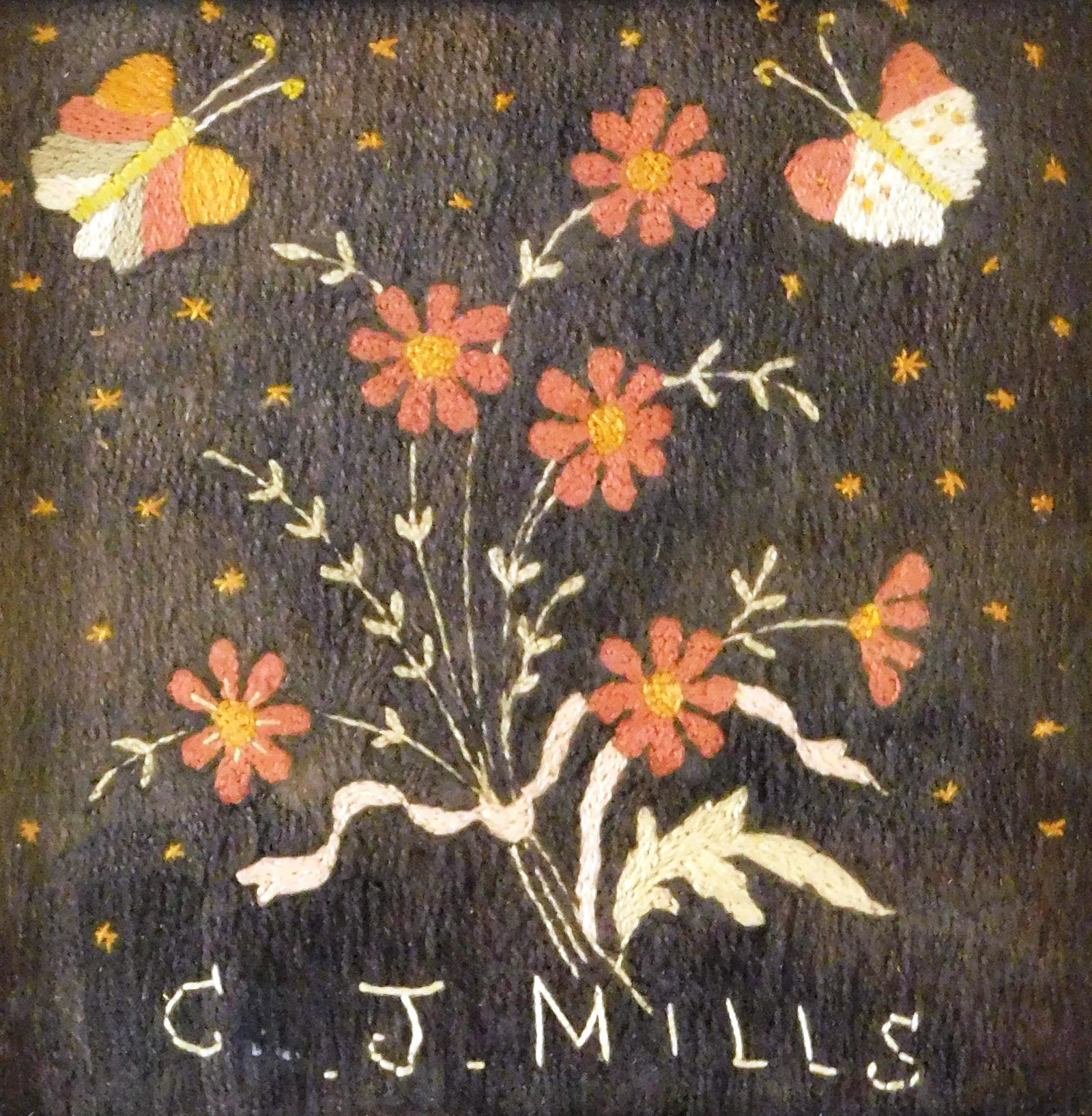 Woolwork, signed "C. J. Mills", 19th/ early 20th C., embroidered picture of a bouquet of red flowers (1 of 2)
