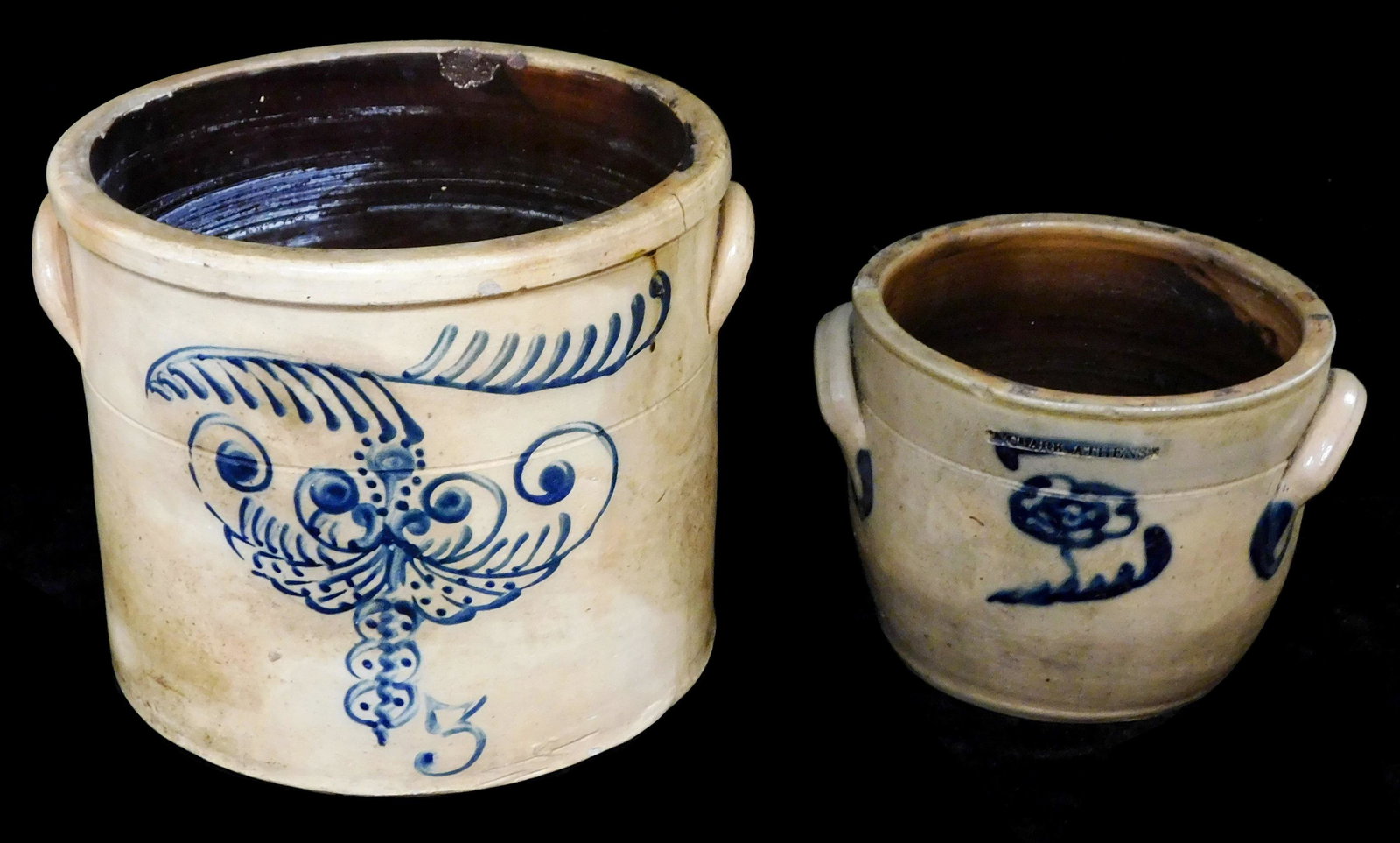 Two salt-glazed stoneware crocks, American, 19th C., both with cobalt decoration, details include: (1 of 5)