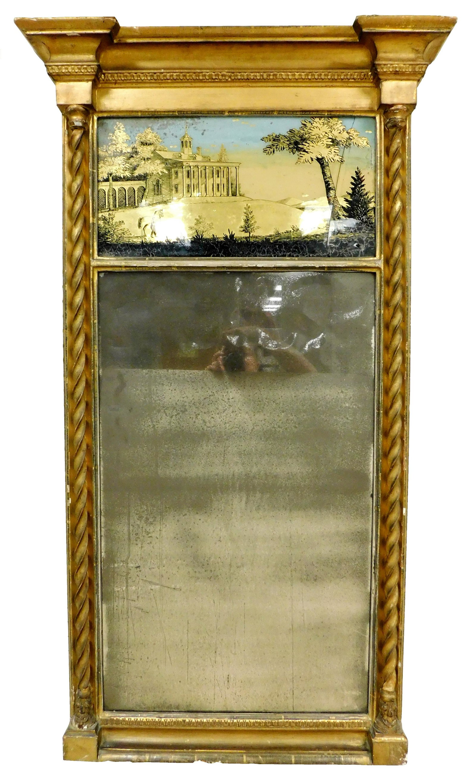 Wall mirror, English, early 19th C., two part gilt frame, projecting cornice, spiral pilasters,: Wall mirror, English, early 19th C., two part gilt frame, projecting cornice, spiral pilasters, upper panel with reverse image of house on hill with colonnade front (possibly Mt. Vernon), man and hors