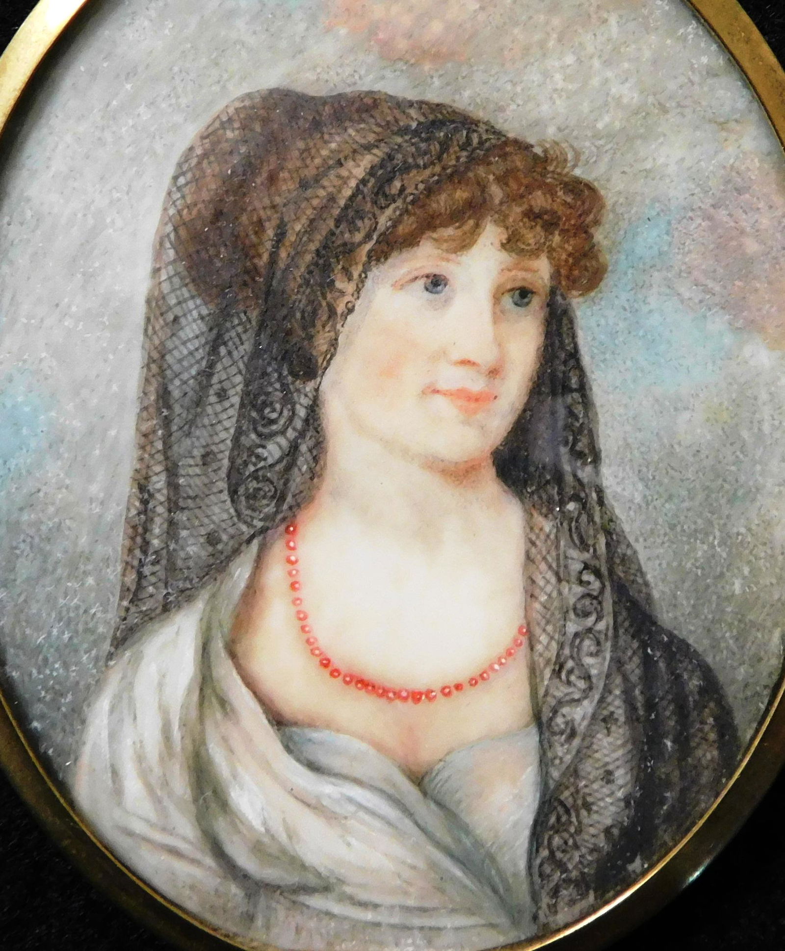 MINIATURE: Portrait of a woman with black lace head scarf, 19th C., watercolor on oval support, (1 of 3)