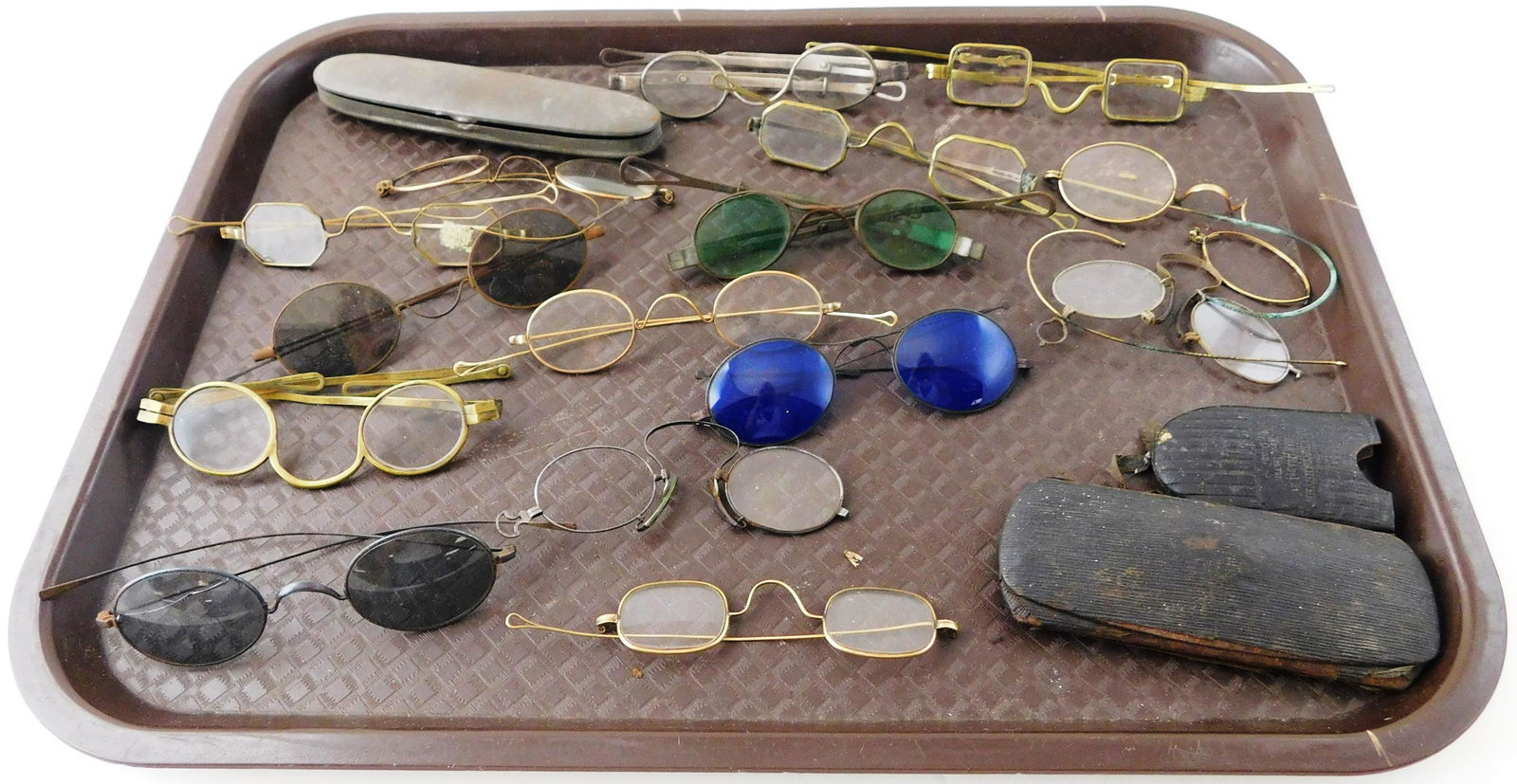 Early eyeglasses, late 18th C. to early 20th C., fifteen pairs including four tinted, three cases,: Early eyeglasses, late 18th C. to early 20th C., fifteen pairs including four tinted, three cases, four tinted, some with telescoping arms and/or looped ends, one with maker's stamp "A. C. Peck" and o
